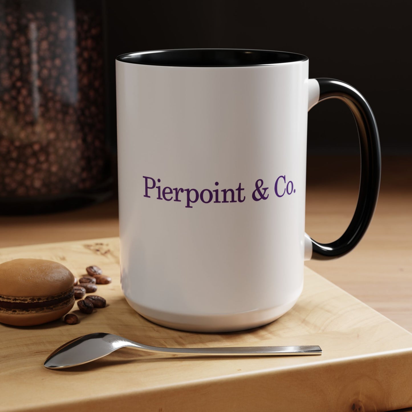 Kitchen image of a 15 oz White Ceramic Mug with black handle/interior featuring the purple Pierpoint & Co logo from the HBO TV show Industry printed on both sides, sold by ScriptedBrand.