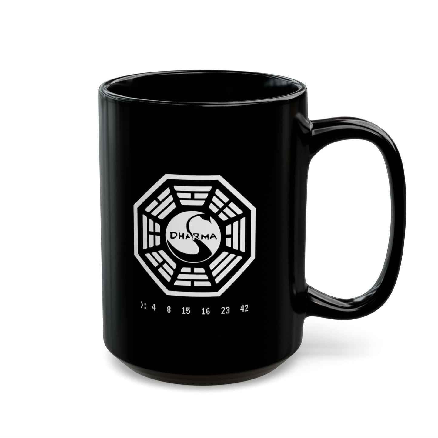 Mockup view of 15 oz Black Ceramic Mug on a desk featuring the Dharma Initiative swan station logo from the TV show LOST, including the Hatch numbers 4 8 15 16 23 42. Graphic is printed white on both sides.