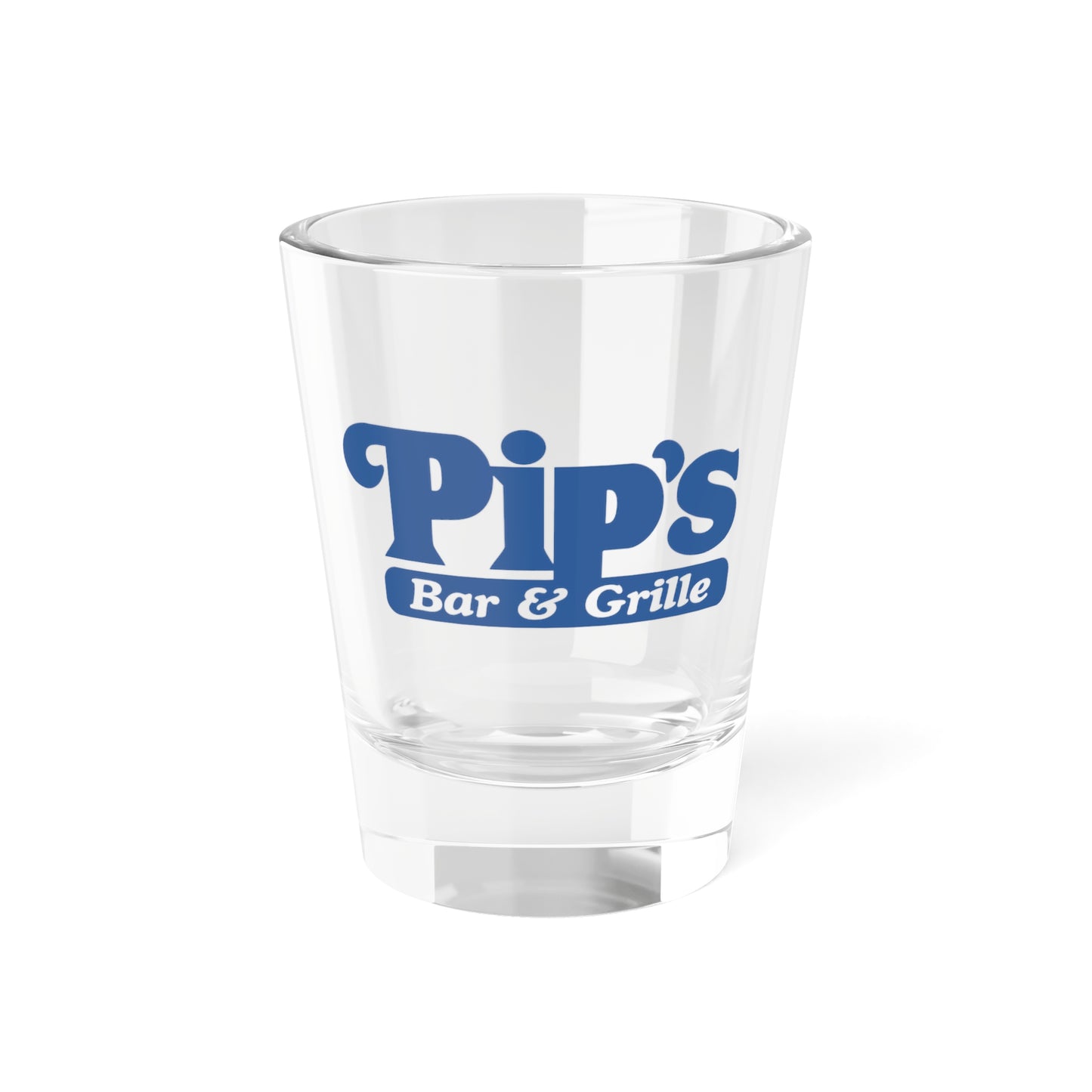Front side of a 1.5 oz ounce clear shot glass featuring the Pips Bar and Grill logo from the Apple TV show Severance printed on one side.