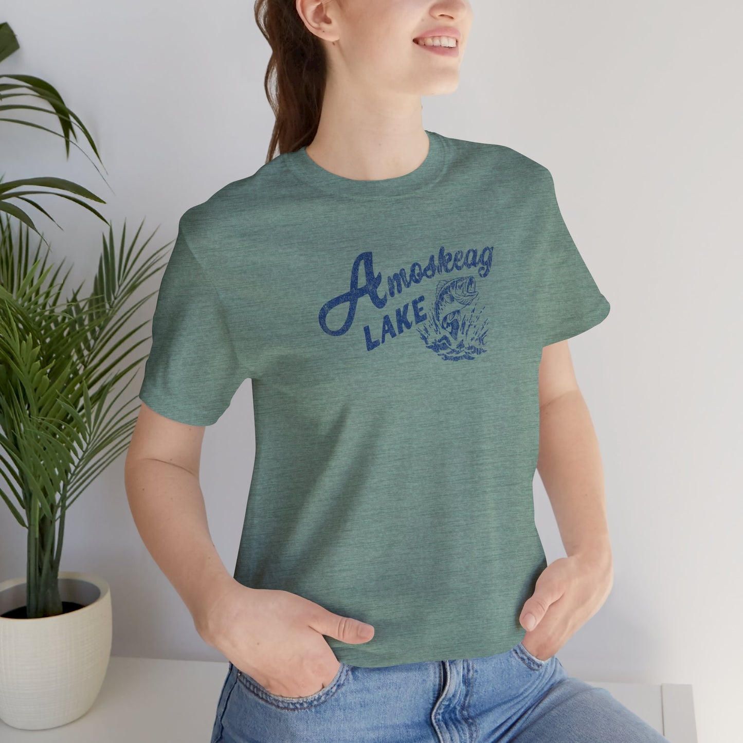 Woman wearing heather green t-shirt featuring the Amoskeag Lake graphic worn by Salma Hayek in the movie Grown Ups in a vintage distressed style.