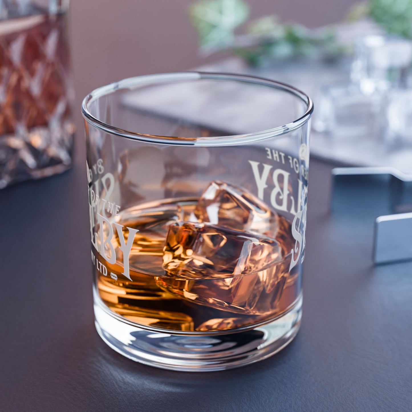 side view of a half-filled 10 ounce Rocks Glass with Shelby Company LTD logo from Peaky Blinders printed on both sides