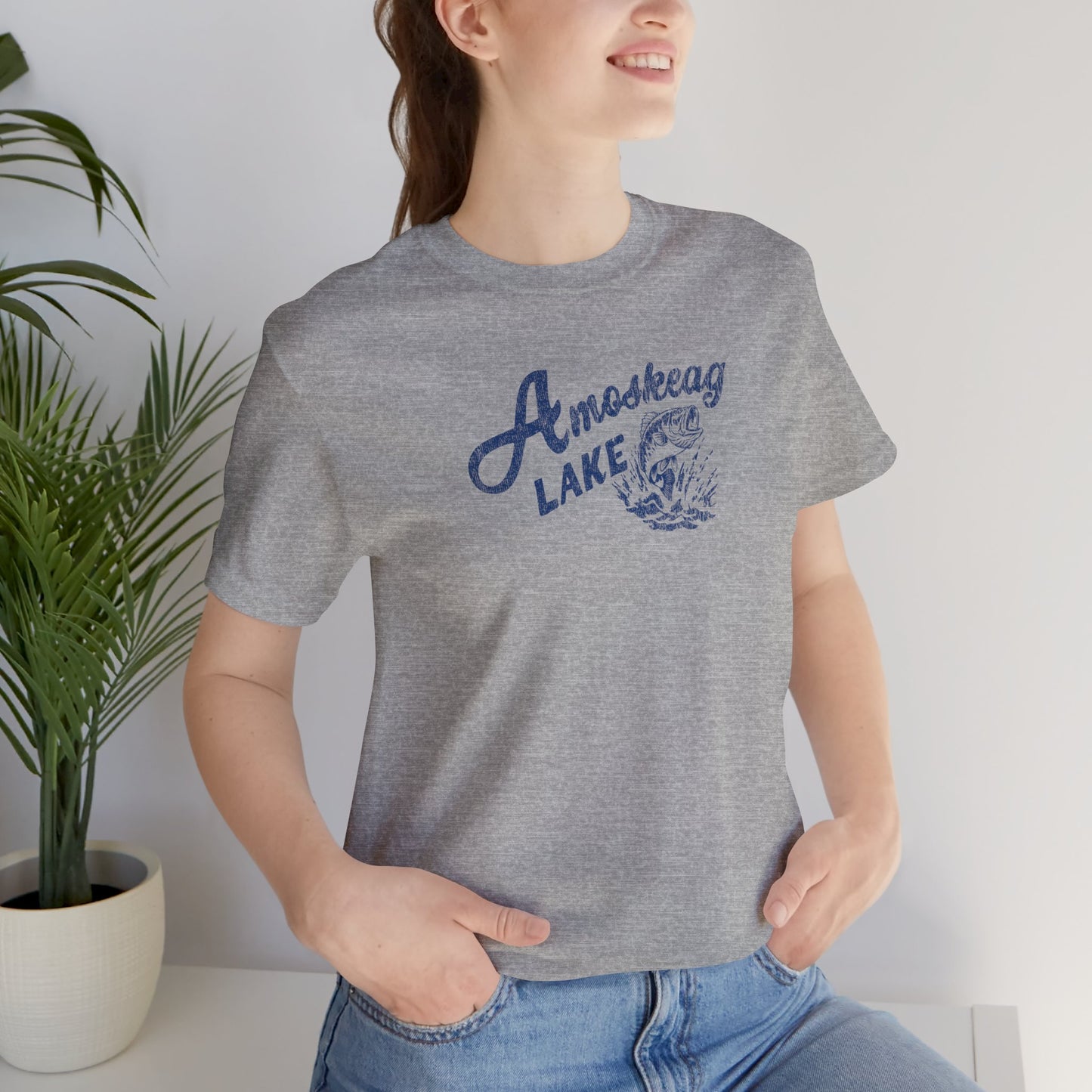 Woman wearing heather gray t-shirt featuring the Amoskeag Lake graphic worn by Salma Hayek in the movie Grown Ups in a vintage distressed style.