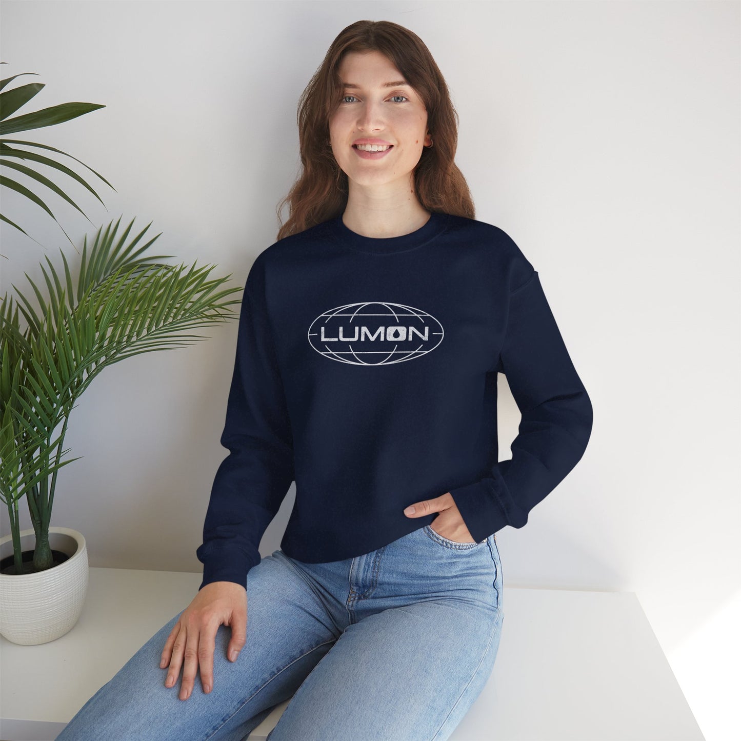Female model wearing a navy blue Soft Gildan 18000 crew neck sweatshirt featuring the Lumon Industries logo from the Apple TV show Severance in a vintage distressed style.