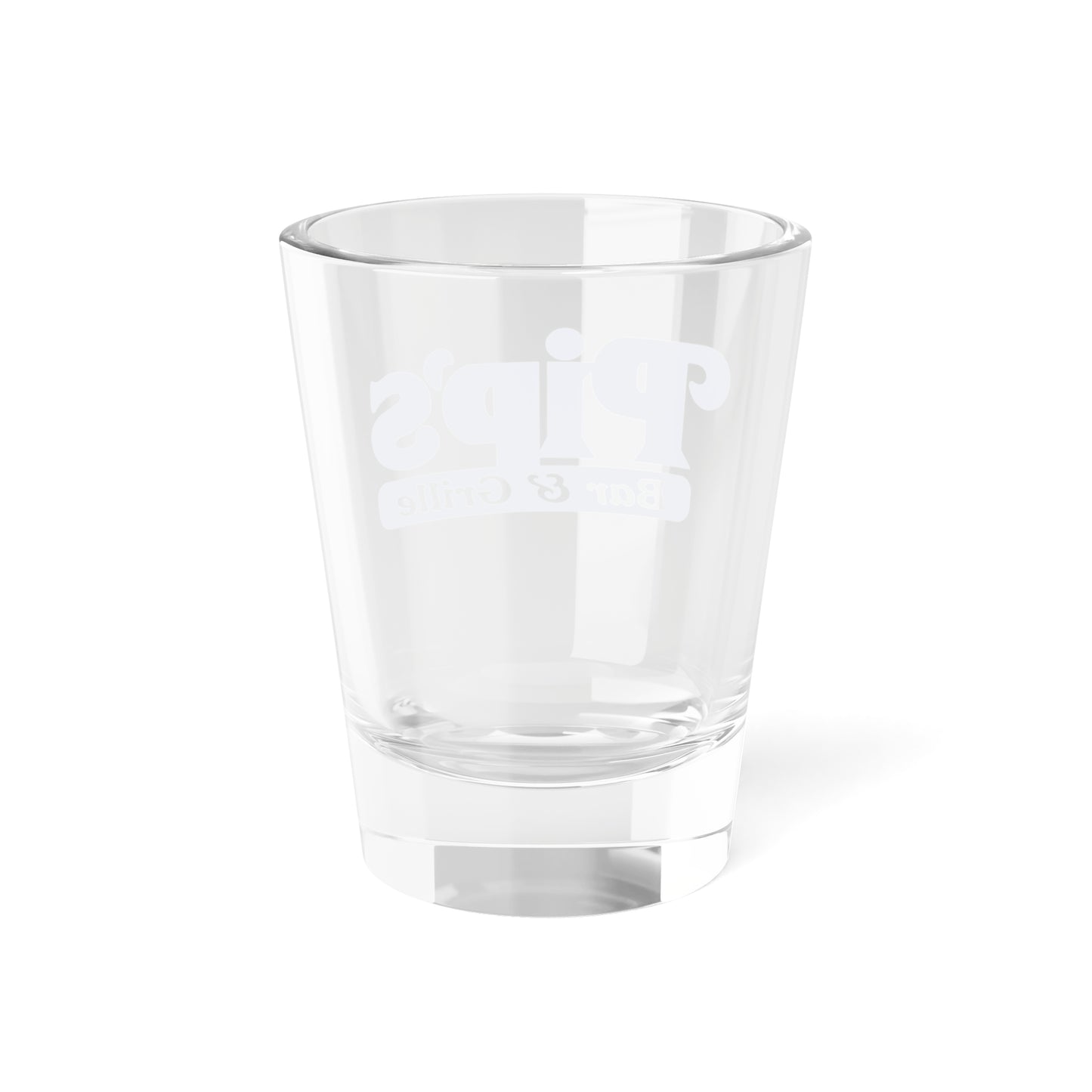 Back side of a 1.5 oz ounce clear shot glass featuring the Pips Bar and Grill logo from the Apple TV show Severance printed on one side.