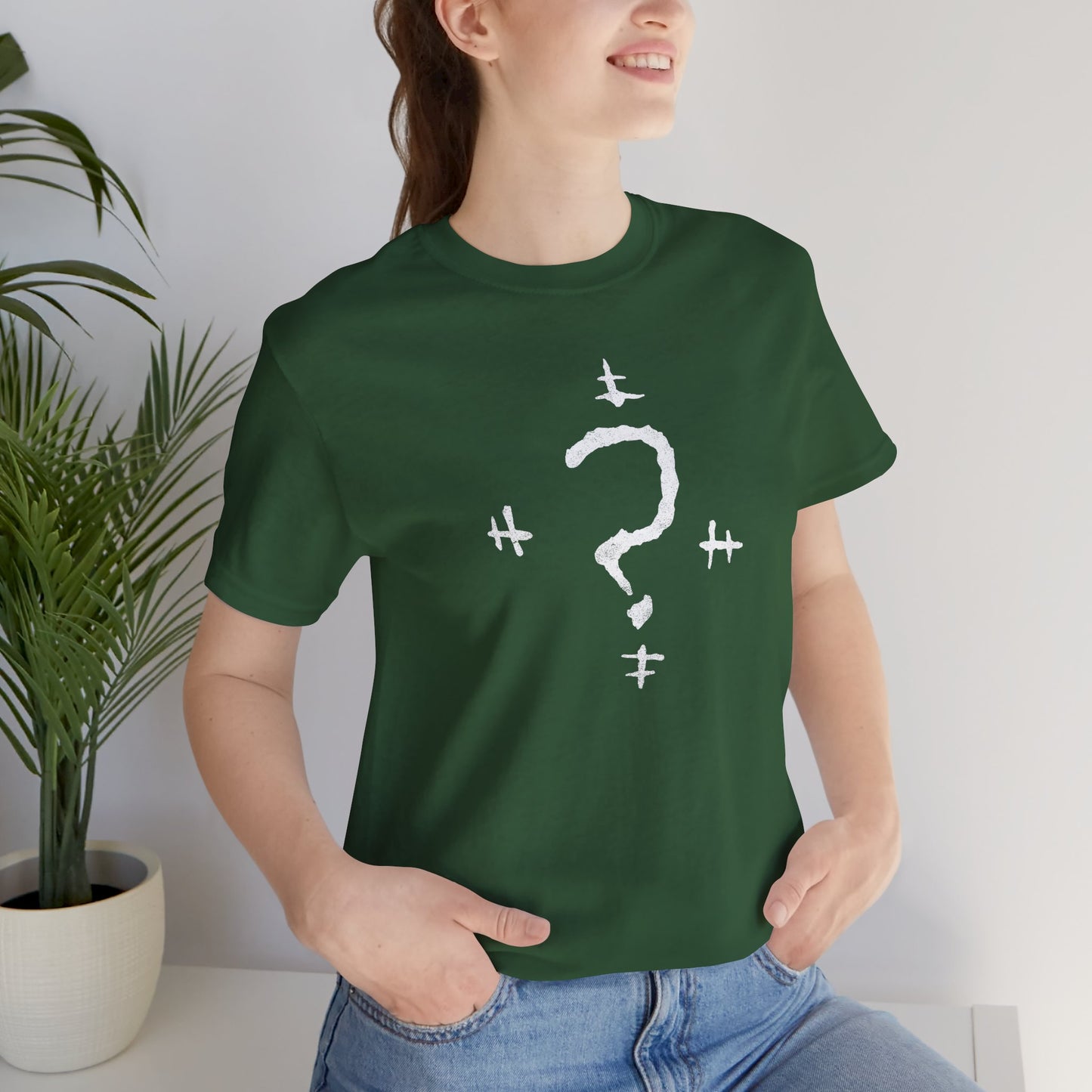 Woman wearing a Green t-shirt featuring the Riddler Question Mark logo from the movie The Batman in vintage distressed style.