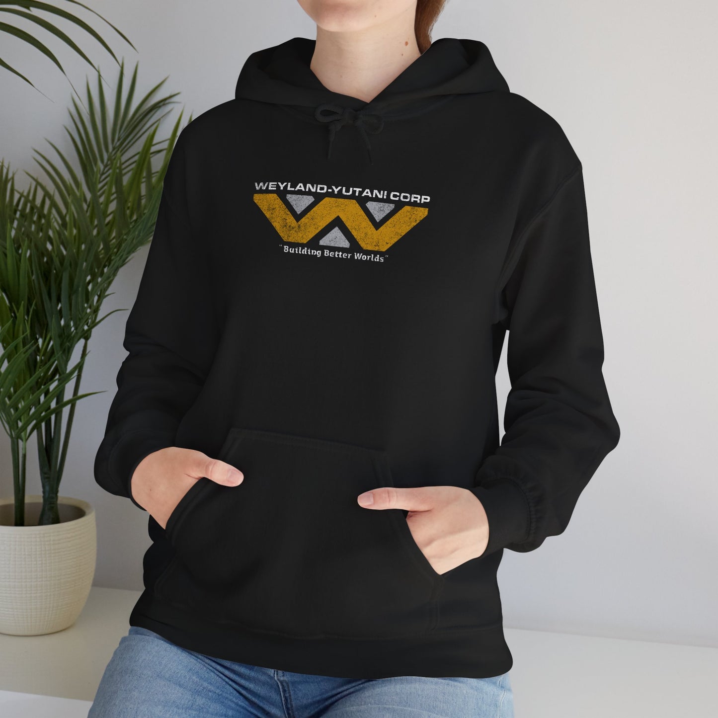 Person wearing a Black hoodie with Weyland-Yutani Corp logo from Alien movies