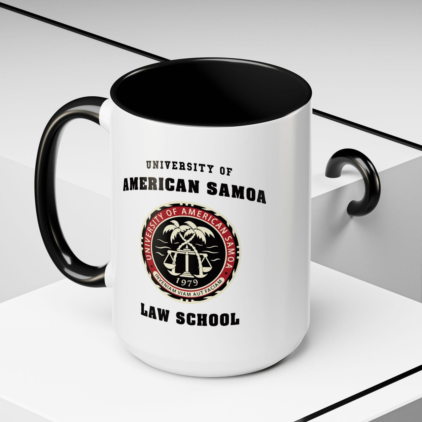 Angled view of 15 oz Ceramic mug with black handle featuring University of American Samoa Law School logo from Better Call Saul on both sides.