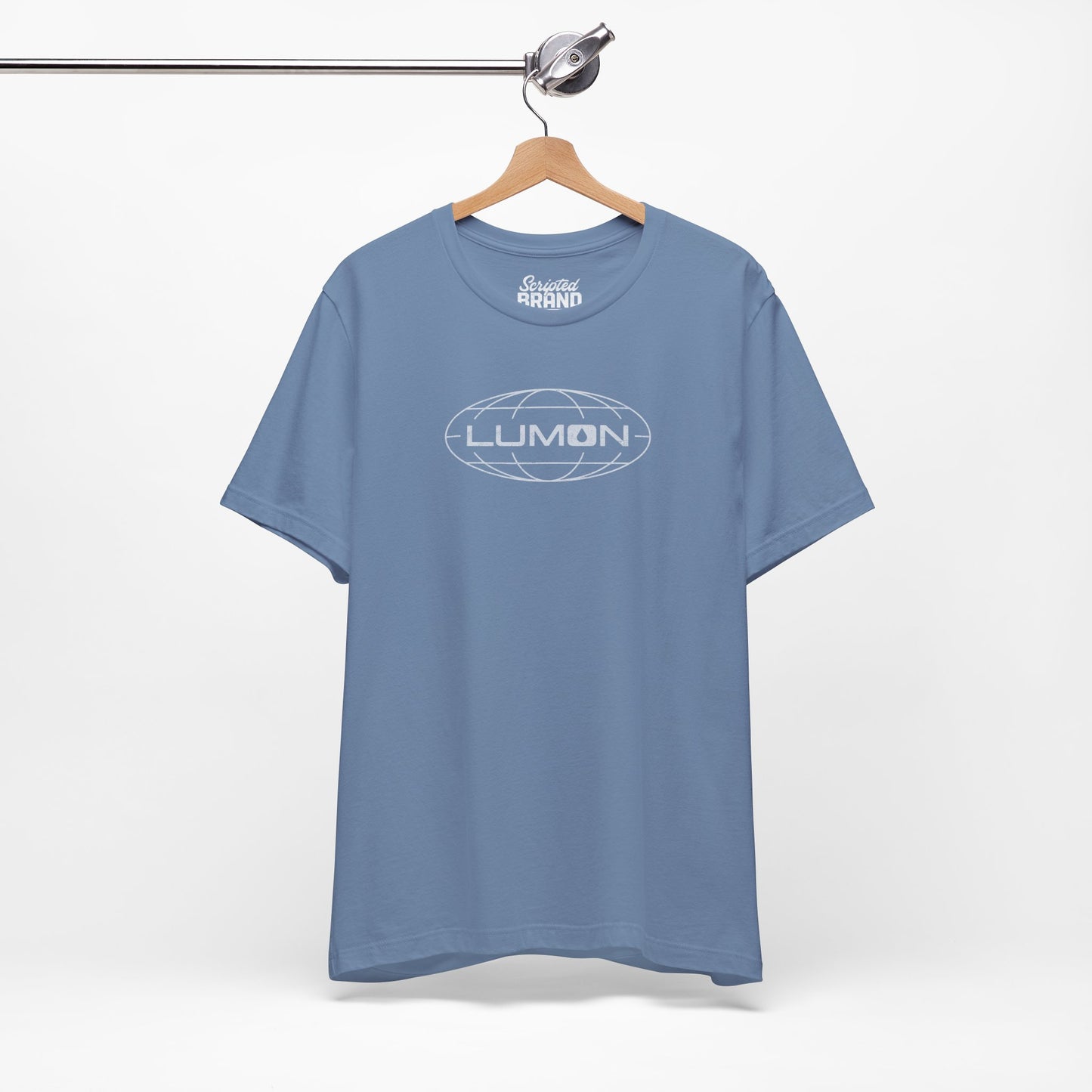 Steel blue colored soft Bella+Canvas shirtsleeve t-shirt with the Lumon Industries logo from the TV show Severance in a vintage distressed ink-stamped style, hanging on a hanger