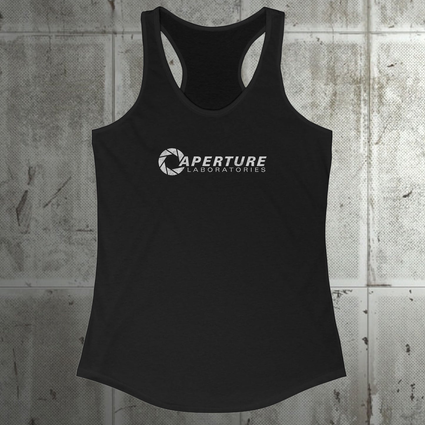 Front view of a black colored Women's Racerback Tank Top Shirt featuring the Aperture Laboratories logo from the video games Portal and Portal 2 in a vintage distressed style, sold by ScriptedBrand.