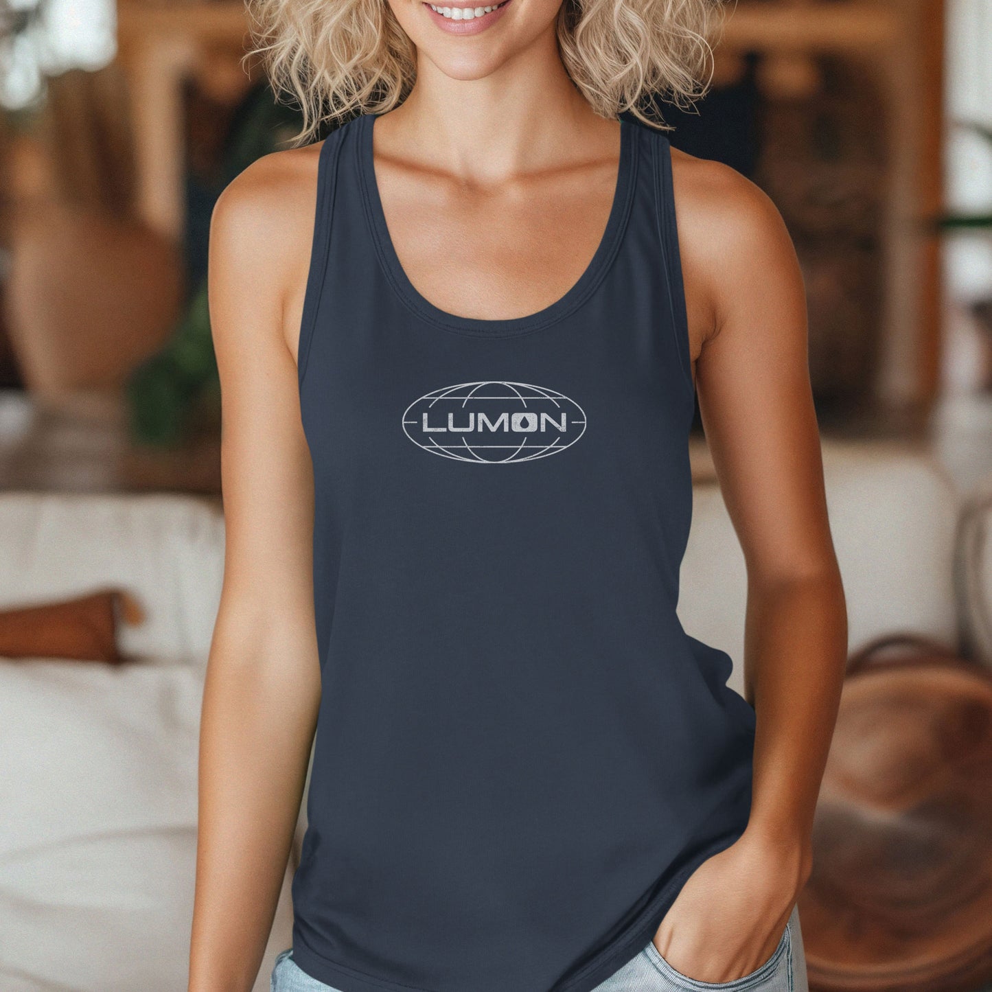 Female model wearing a indigo blue colored Women's Racerback Tank Top Shirt featuring the Lumon Industries logo from the Apple TV show Severance in a vintage distressed style, sold by ScriptedBrand.