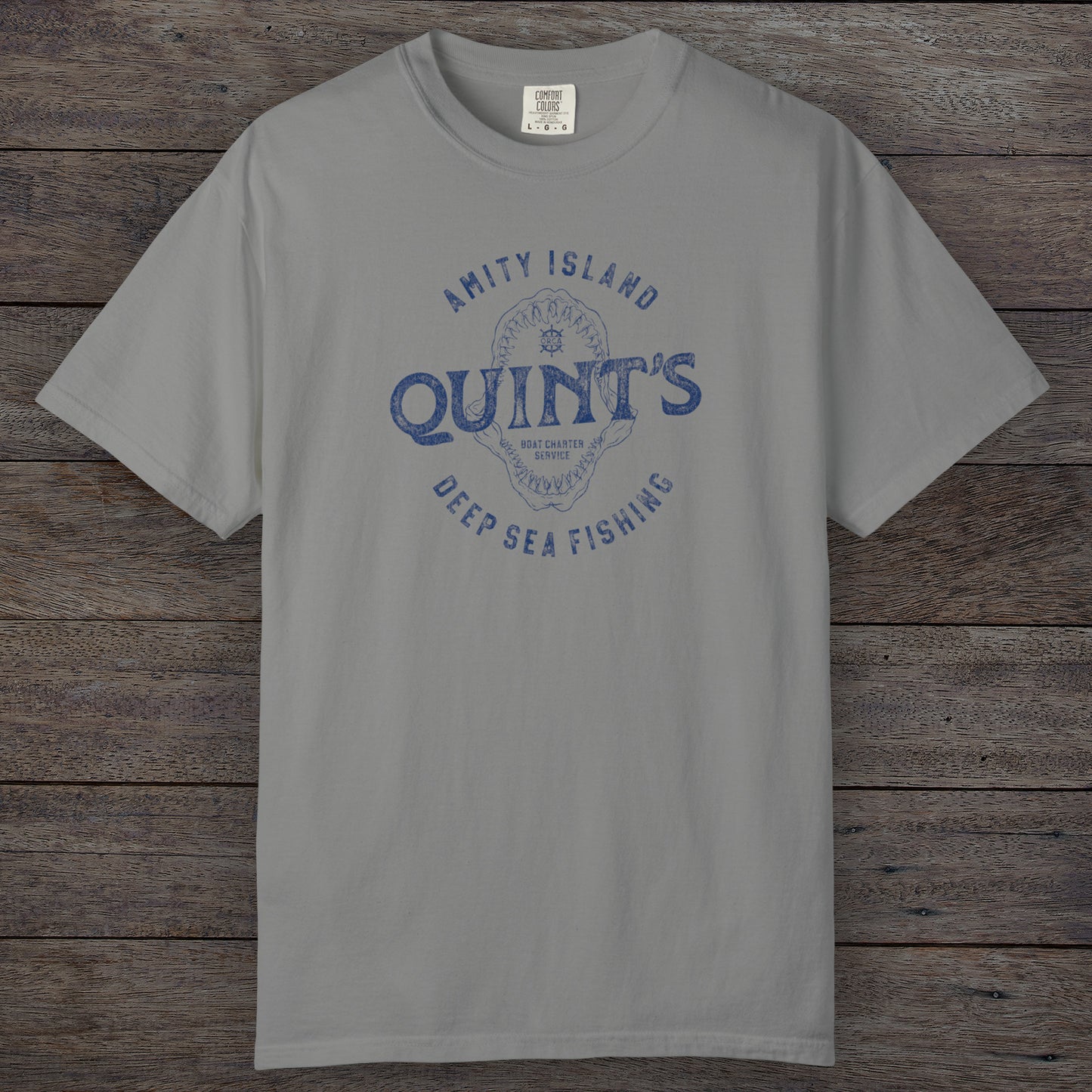 Granite Comfort Colors t-shirt with vintage Quint’s Deep Sea Fishing logo from Jaws, featuring shark graphic, distressed style.