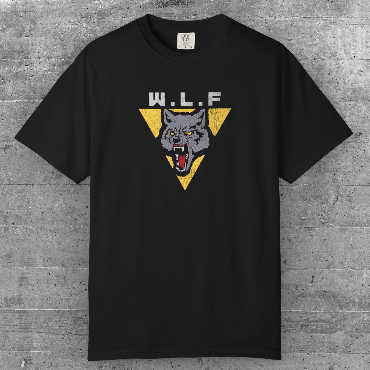Black t-shirt with distressed WLF logo from The Last of Us, featuring a snarling wolf inside a yellow triangle.