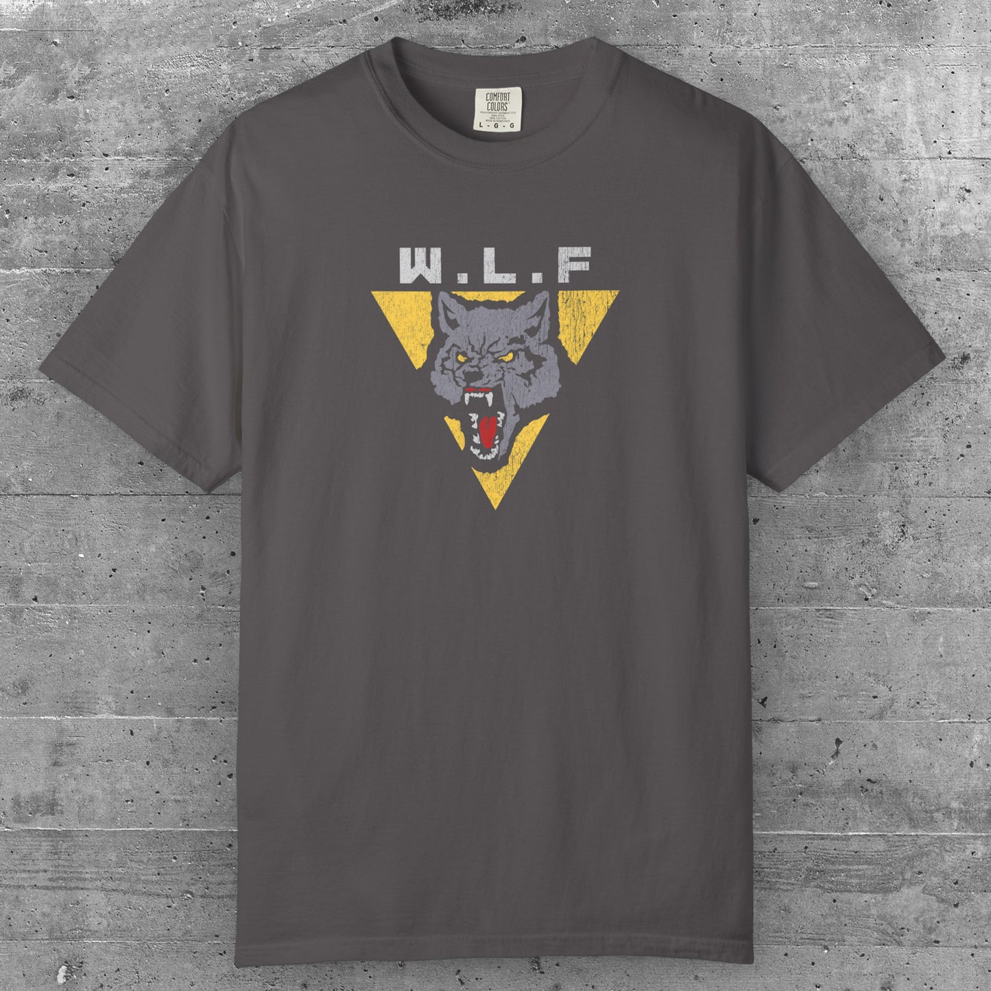 Graphite t-shirt with distressed WLF logo from The Last of Us, featuring a snarling wolf inside a yellow triangle.