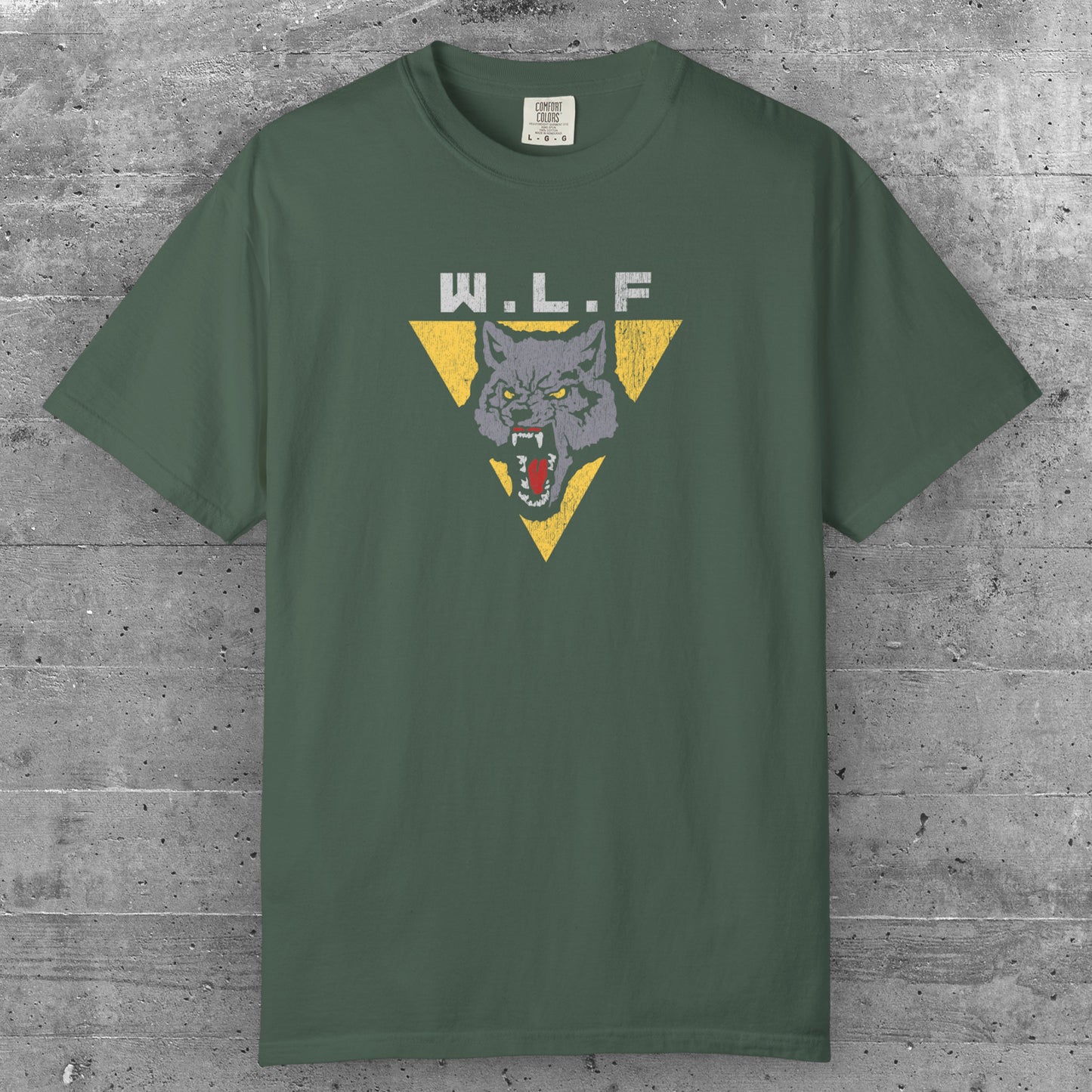 Blue Spruce t-shirt with distressed WLF logo from The Last of Us, featuring a snarling wolf inside a yellow triangle.