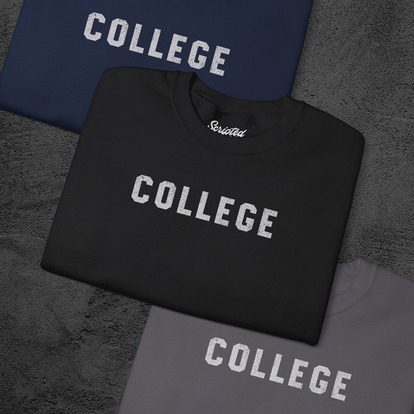 Group of 3 folded soft unisex Gildan 18000 sweatshirts with the word COLLEGE that John Belushi wore in the movie Animal House, in a vintage distressed ink-stamped worn-in style.