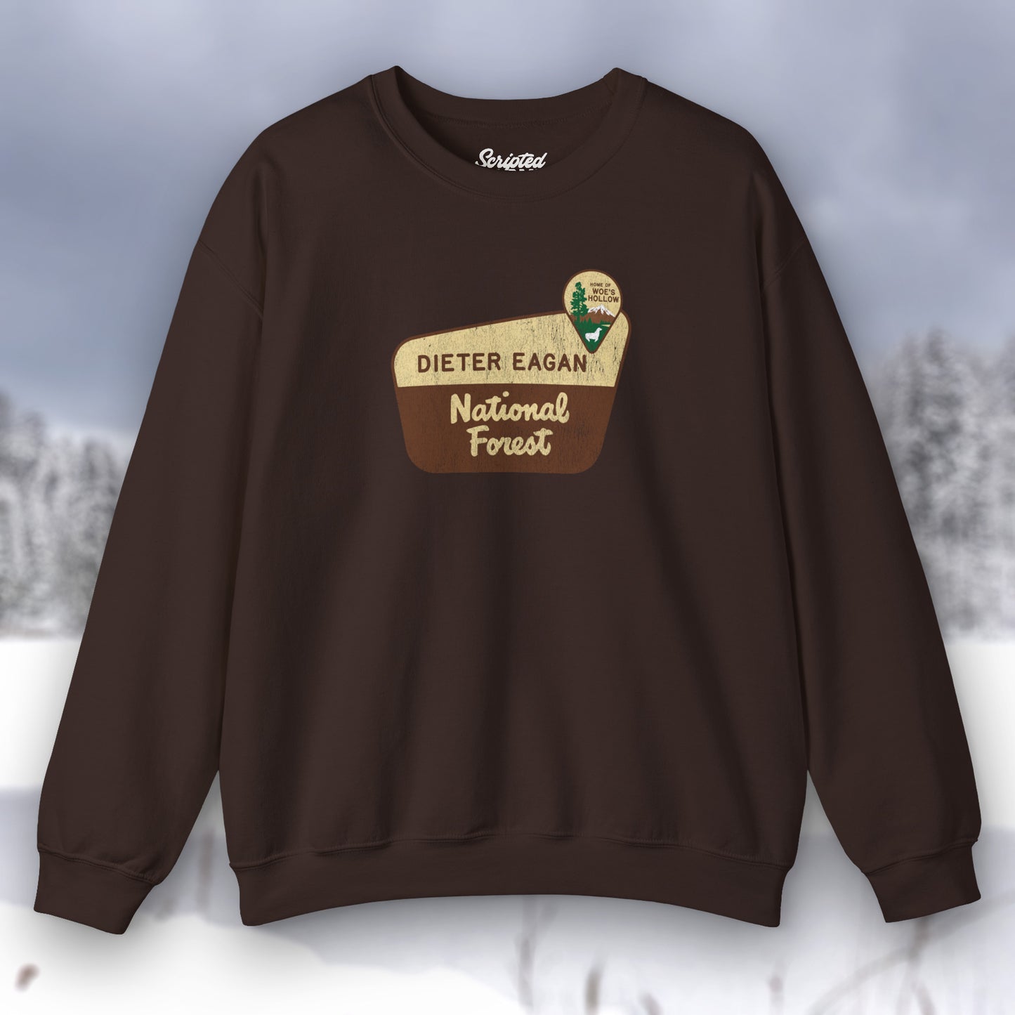 Front view of a dark chocolate brown Soft Unisex Gildan 18000 sweatshirt featuring a logo graphic of the Dieter Eagan National Forest sign designed by ScriptedBrand, inspired by the TV show Severance in a vintage distressed style.