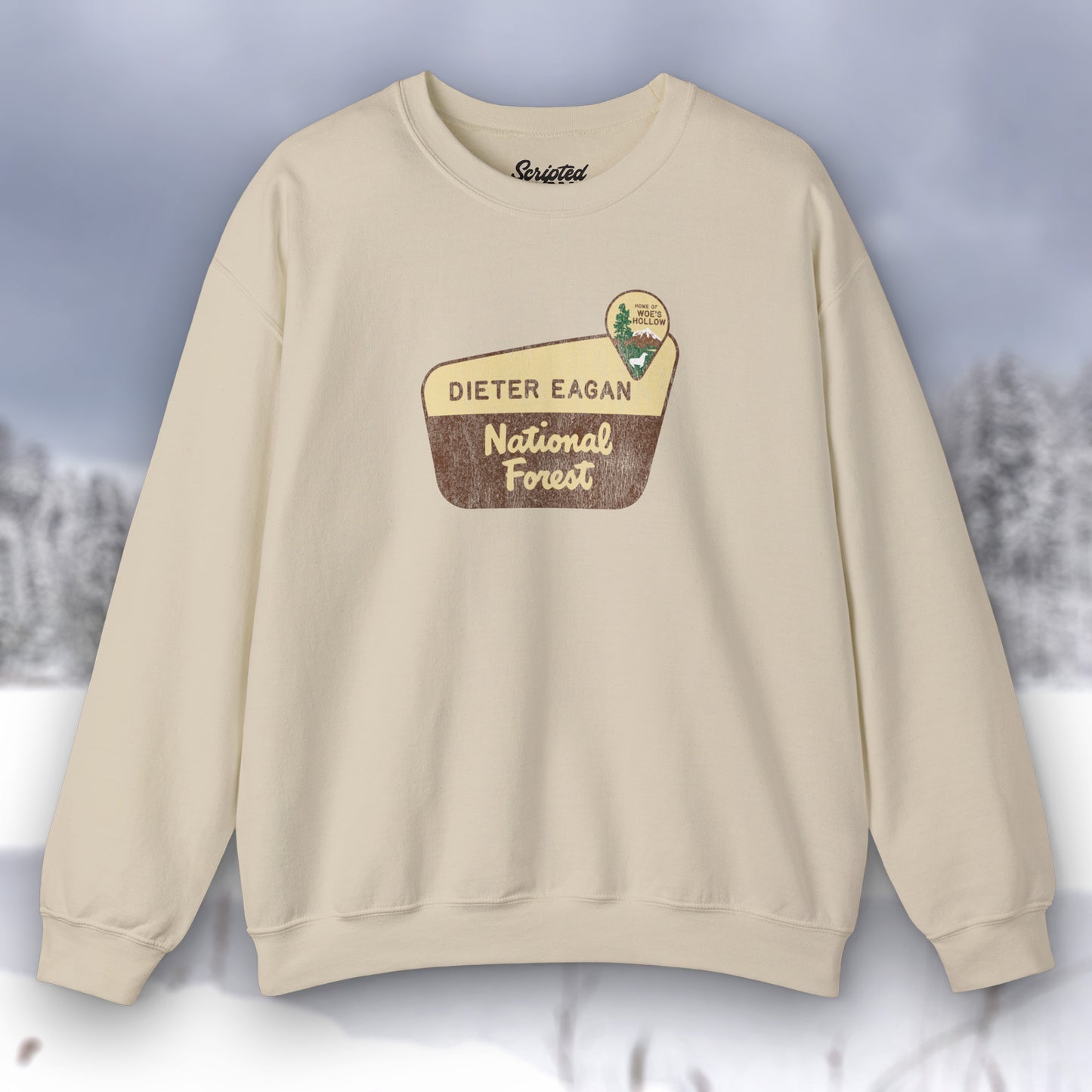 Front view of a sand tan Soft Unisex Gildan 18000 sweatshirt featuring a logo graphic of the Dieter Eagan National Forest sign designed by ScriptedBrand, inspired by the TV show Severance in a vintage distressed style.