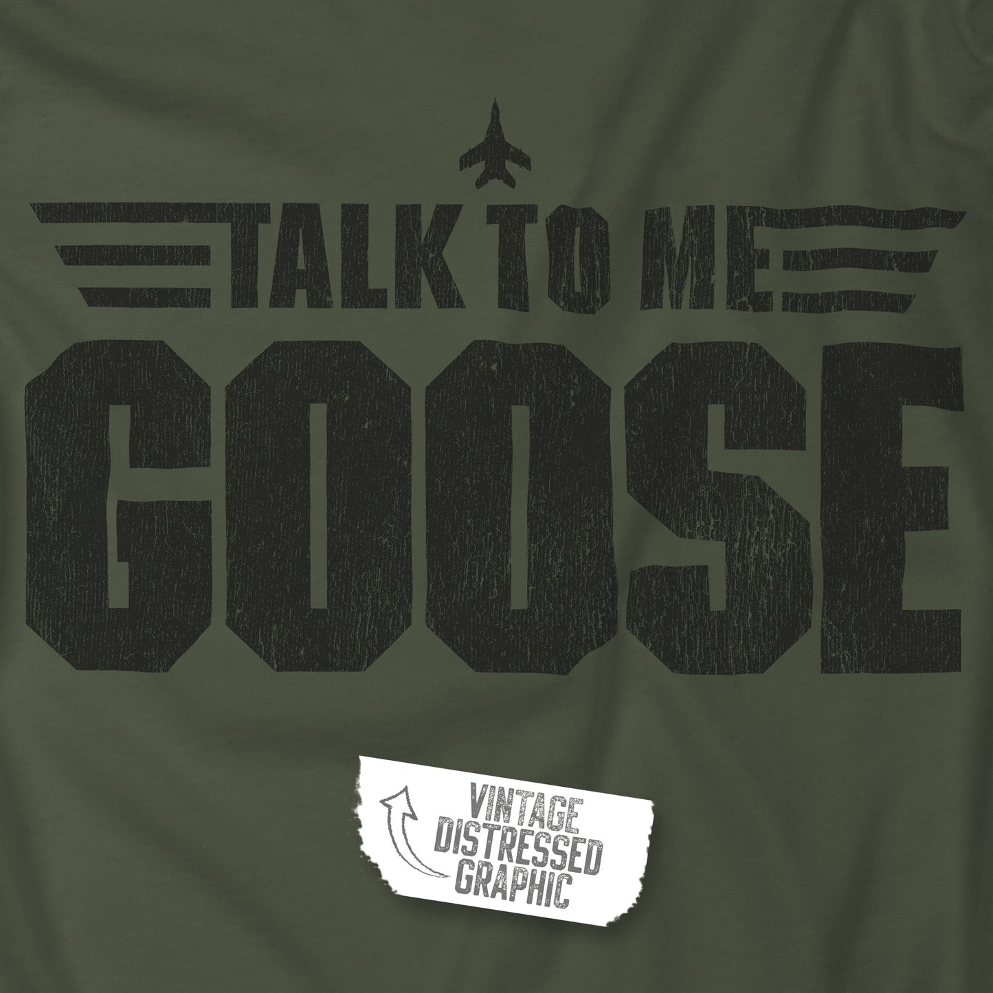 Closeup of Military green crewneck sweatshirt with distressed “Talk to Me Goose” graphic, inspired by the movie Top Gun.