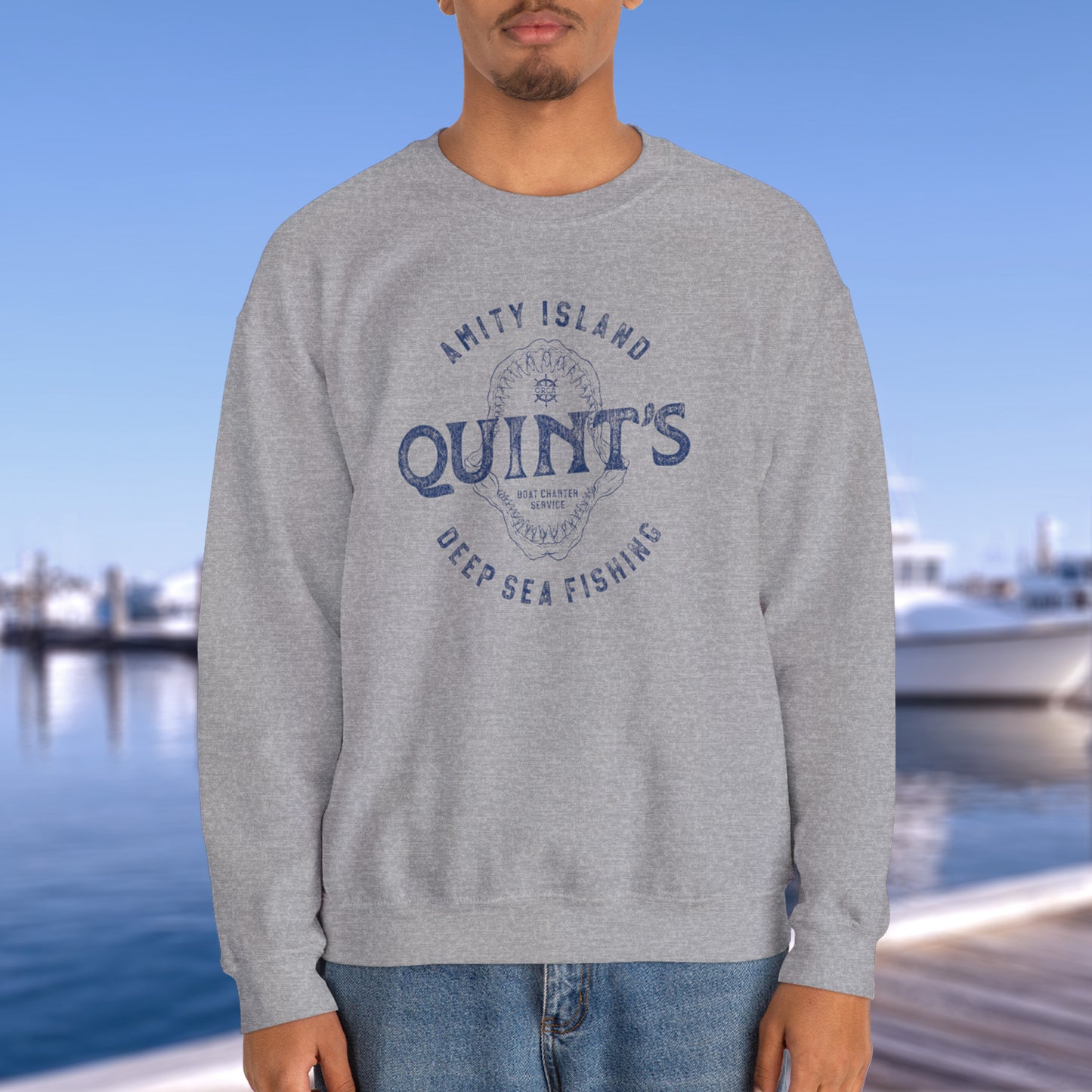 Model wearing athletic grey sweatshirt with Quint's Deep Sea Fishing logo from the movie Jaws in vintage distressed style.