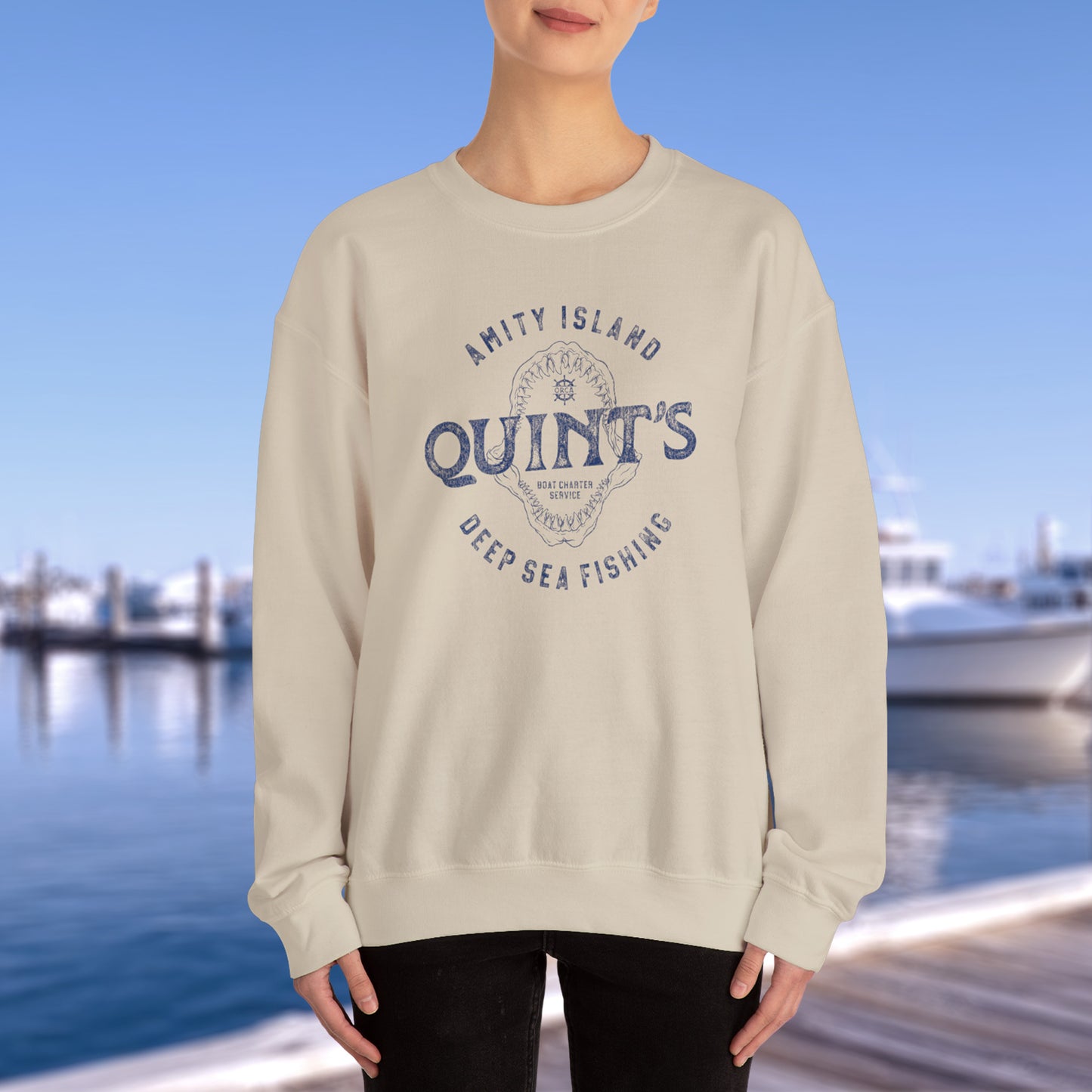 Model wearing sand colored sweatshirt with Quint's Deep Sea Fishing logo from the movie Jaws in vintage distressed style.