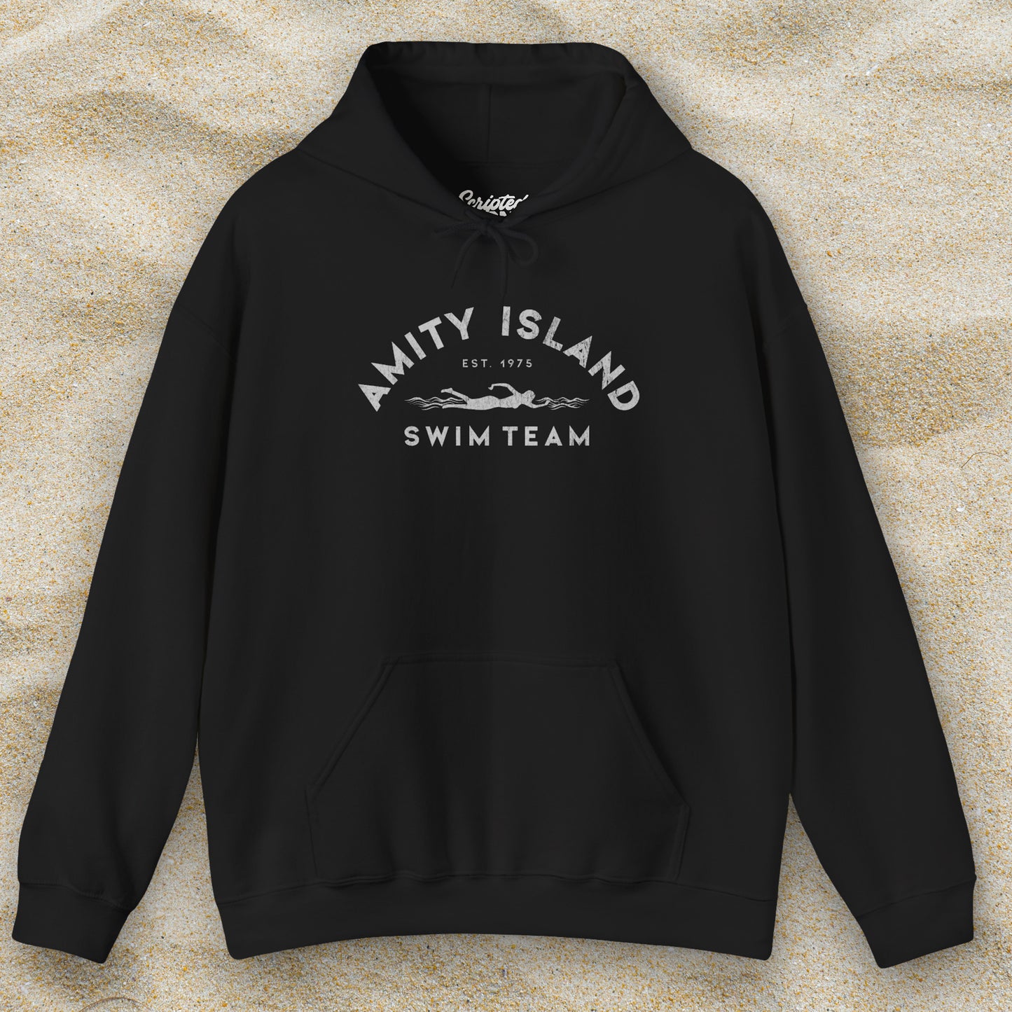Front view of a black colored Soft Unisex Hoodie Heavy Blend Hooded Sweatshirt featuring an Amity Island Swim Team logo graphic, designed by ScriptedBrand, and inspired by the movie Jaws in a vintage distressed style.