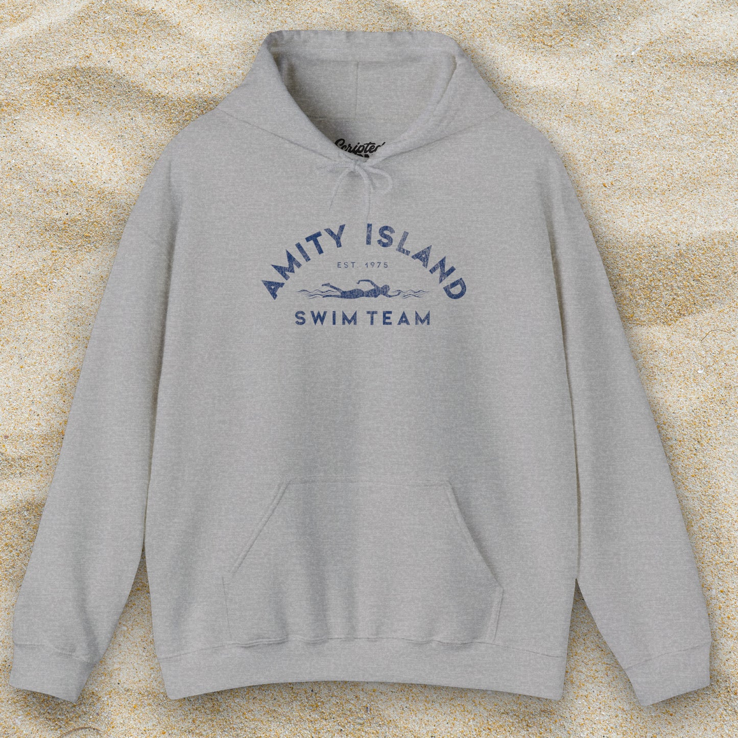 Front view of a sport heather grey colored Soft Unisex Hoodie Heavy Blend Hooded Sweatshirt featuring an Amity Island Swim Team logo graphic, designed by ScriptedBrand, and inspired by the movie Jaws in a vintage distressed style.