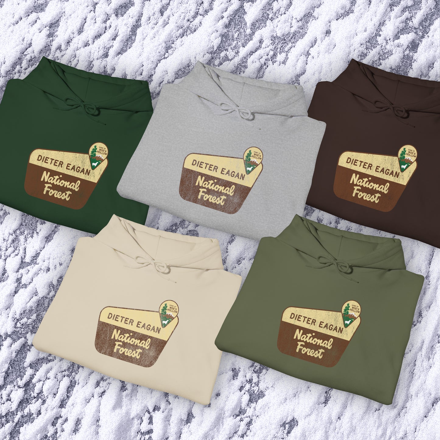 Group of 5 Soft Unisex Hoodie Heavy Blend Hooded Sweatshirts featuring the logo graphic of the Dieter Eagan National Forest inspired by the TV show Severance in a vintage distressed ink-stamped worn-in style.