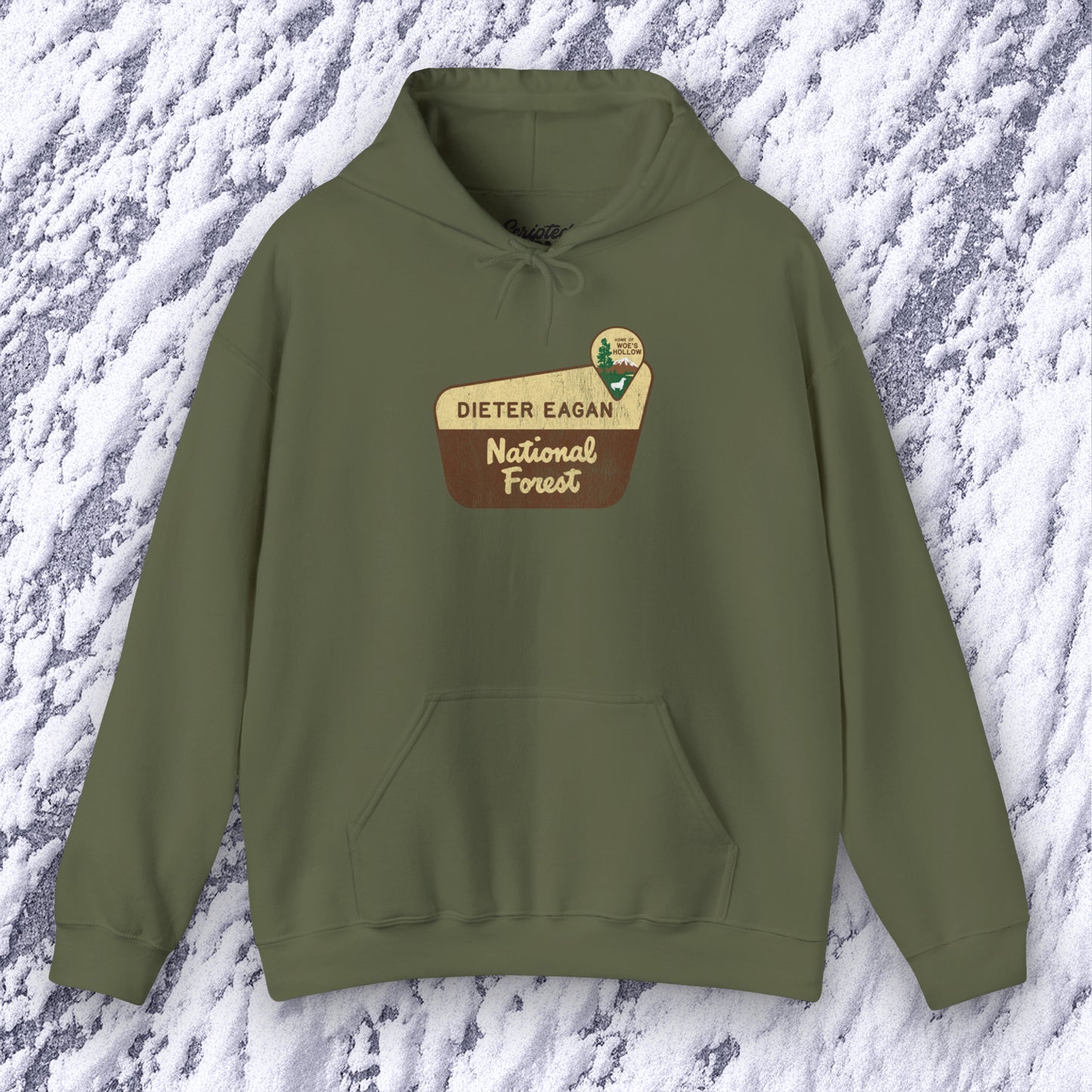 Mockup of a Military green colored Soft Unisex Hoodie Heavy Blend Hooded Sweatshirt featuring the logo graphic of the Dieter Eagan National Forest inspired by the TV show Severance in a vintage distressed ink-stamped worn-in style.