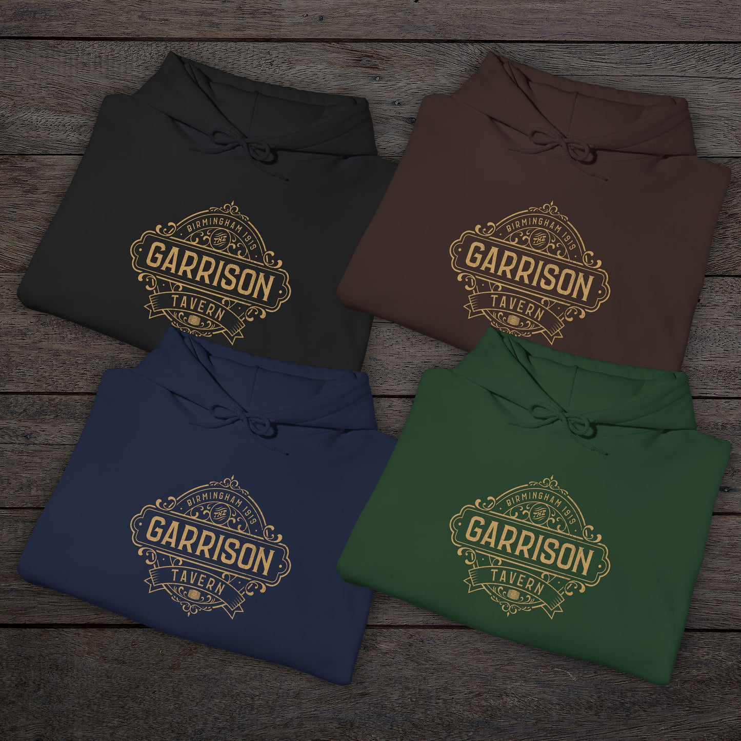 Group of 4 folded Soft Unisex Hoodie Heavy Blend Hooded Sweatshirts featuring the Garrison Tavern Bar Logo Graphic inspired by the TV show and movie Peaky Blinders in a vintage distressed style sold by ScriptedBrand.