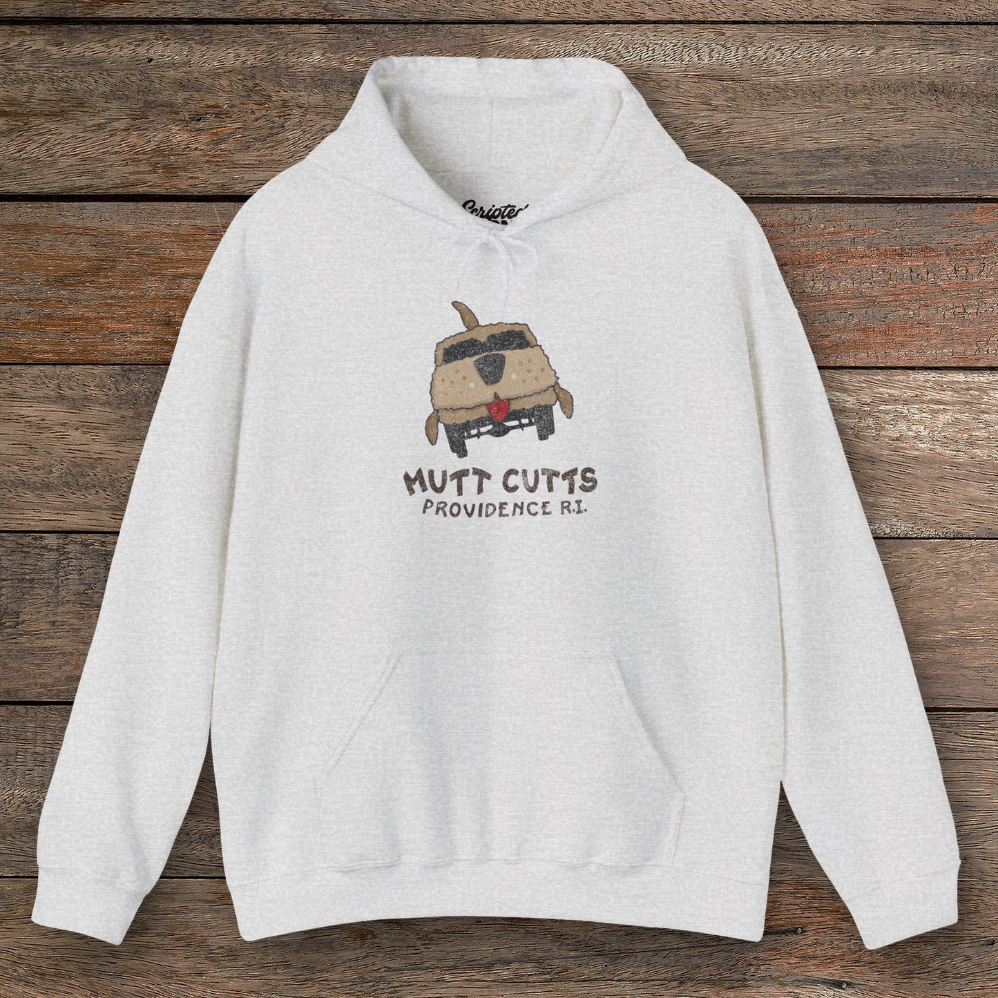Front view of an ash grey colored soft Unisex Hoodie Heavy Blend Hooded Sweatshirt featuring a Mutt Cutts logo graphic inspired by the movie Dumb and Dumber, illustrated by ScriptedBrand in a vintage distressed style.