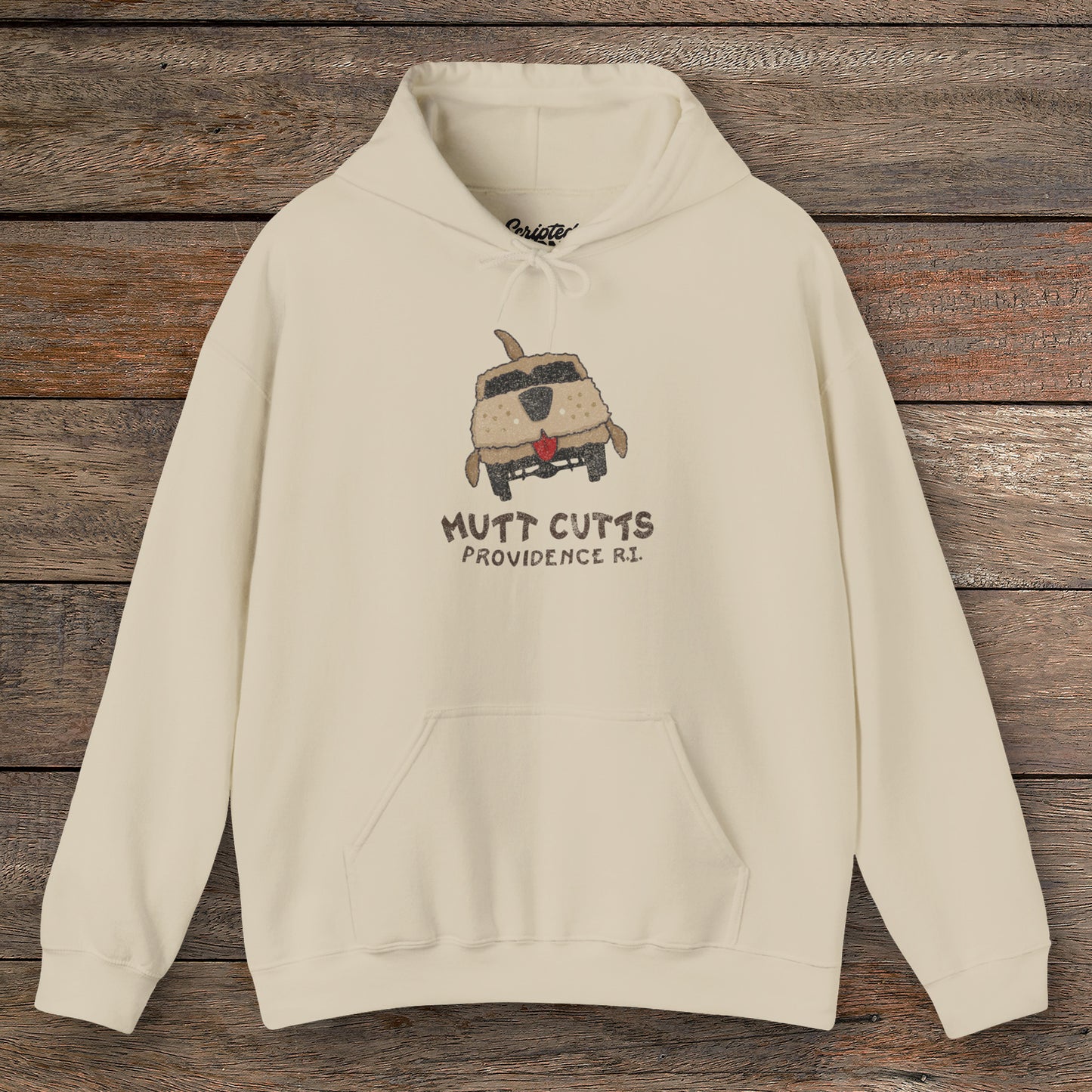 Front view of a sand colored soft Unisex Hoodie Heavy Blend Hooded Sweatshirt featuring a Mutt Cutts logo graphic inspired by the movie Dumb and Dumber, illustrated by ScriptedBrand in a vintage distressed style.