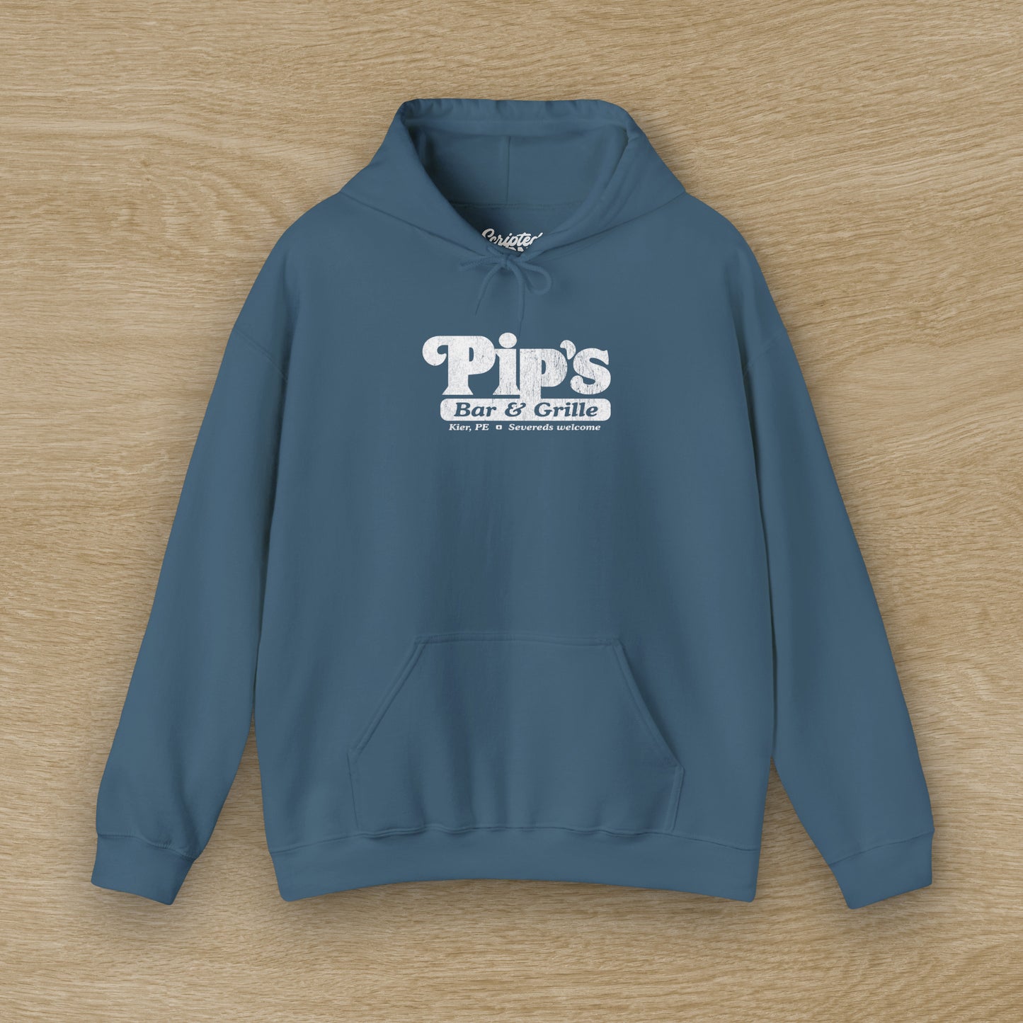 Front view of a indigo blue colored Soft Unisex Hoodie Heavy Blend Hooded Sweatshirt featuring the Pips Bar & Grill logo, with the added text "Severeds Welcome" inspired by the TV show Severance in a vintage distressed style, sold by ScriptedBrand.
