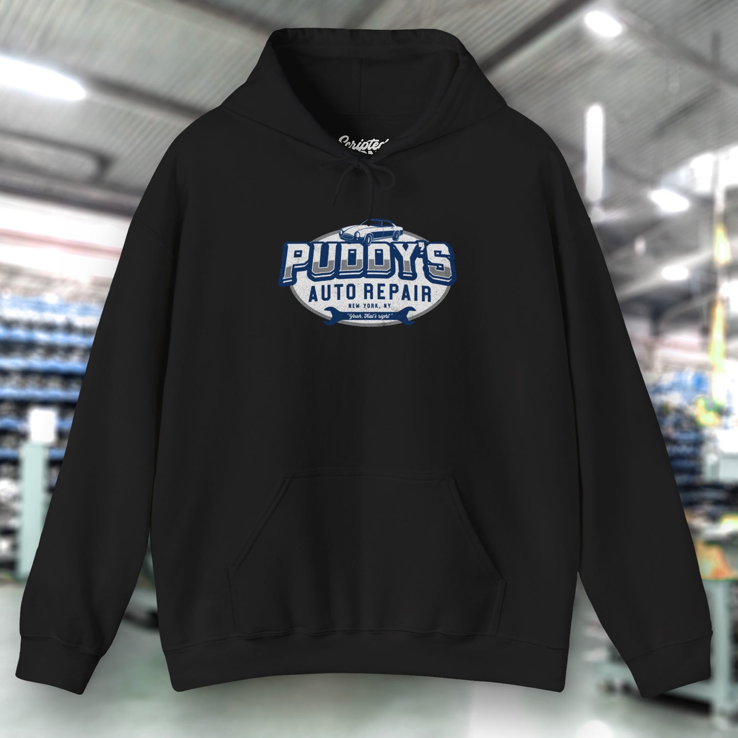 Front view of a black soft Unisex Hoodie Heavy Blend Hooded Sweatshirt featuring a Puddy's Auto Repair graphic designed by ScriptedBrand inspired by the TV show Seinfeld in a vintage distressed style.