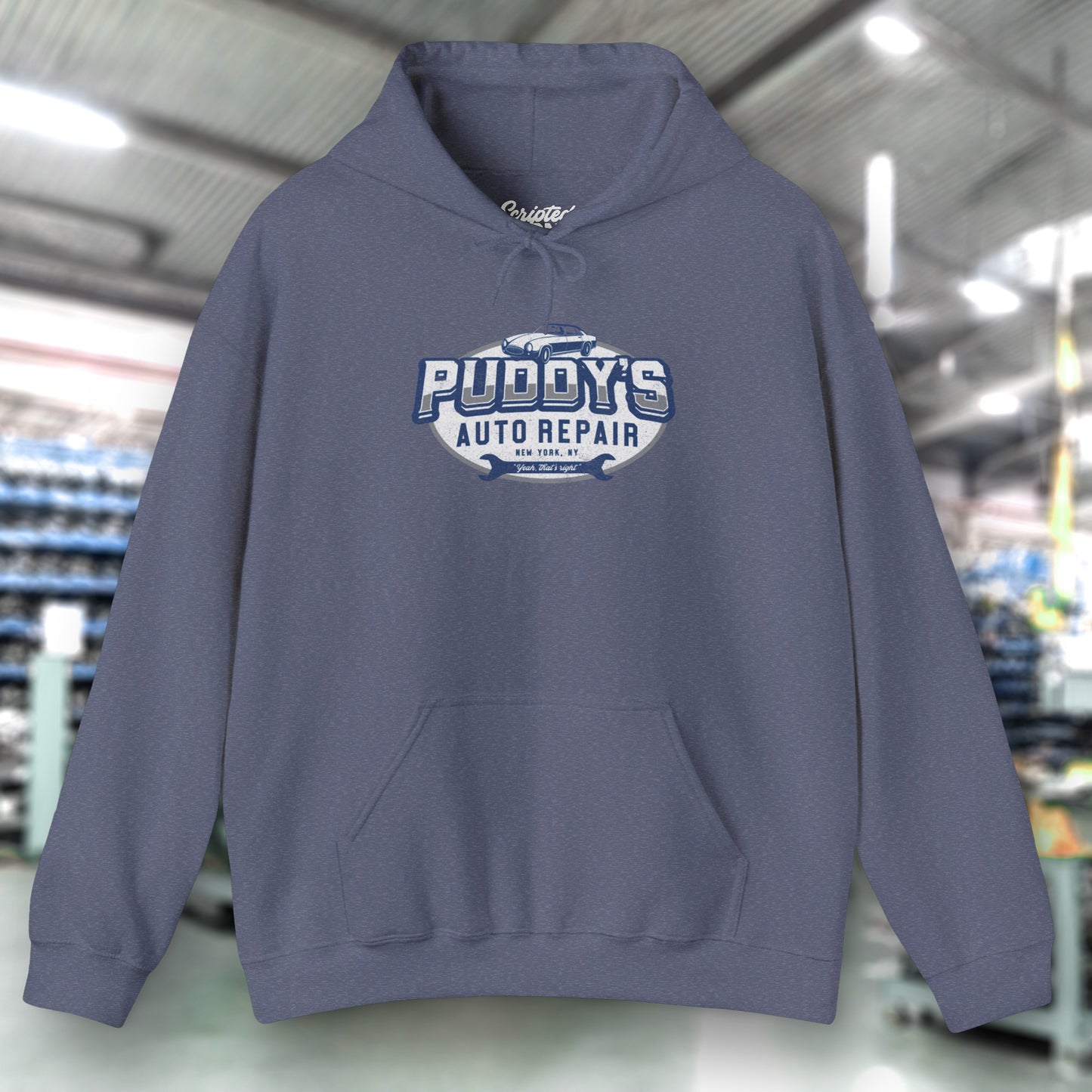 Front view of a heather navy blue soft Unisex Hoodie Heavy Blend Hooded Sweatshirt featuring a Puddy's Auto Repair graphic designed by ScriptedBrand inspired by the TV show Seinfeld in a vintage distressed style.