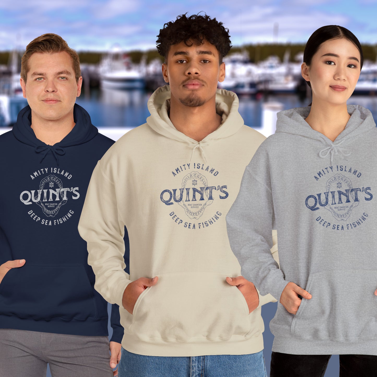 3 models wearing Soft Unisex Hoodie Heavy Blend Hooded Sweatshirts featuring a Quint's Deep Sea Fishing Boat Charters logo graphic, designed by ScriptedBrand, and inspired by the movie Jaws in a vintage distressed style.