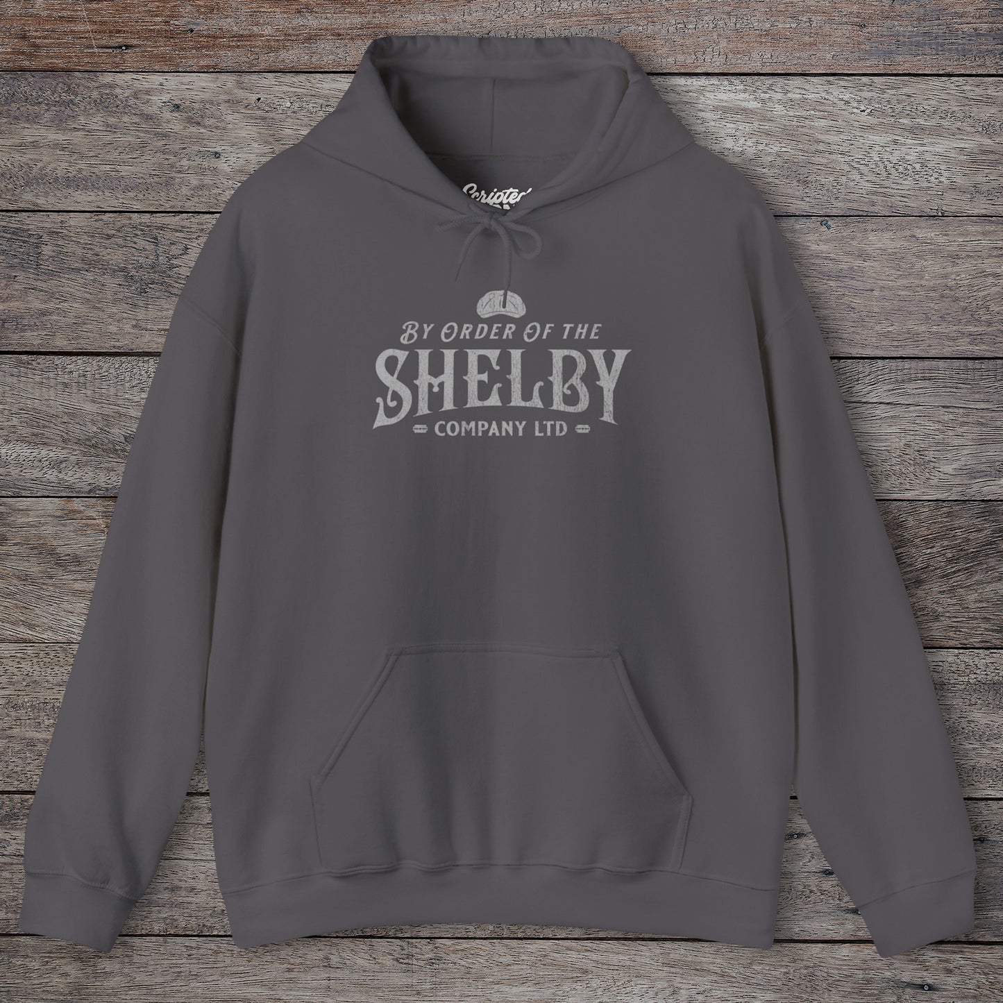 Front view of a charcoal Shelby Company Ltd hoodie with vintage logo from Peaky Blinders, featuring flat cap and razor blades.