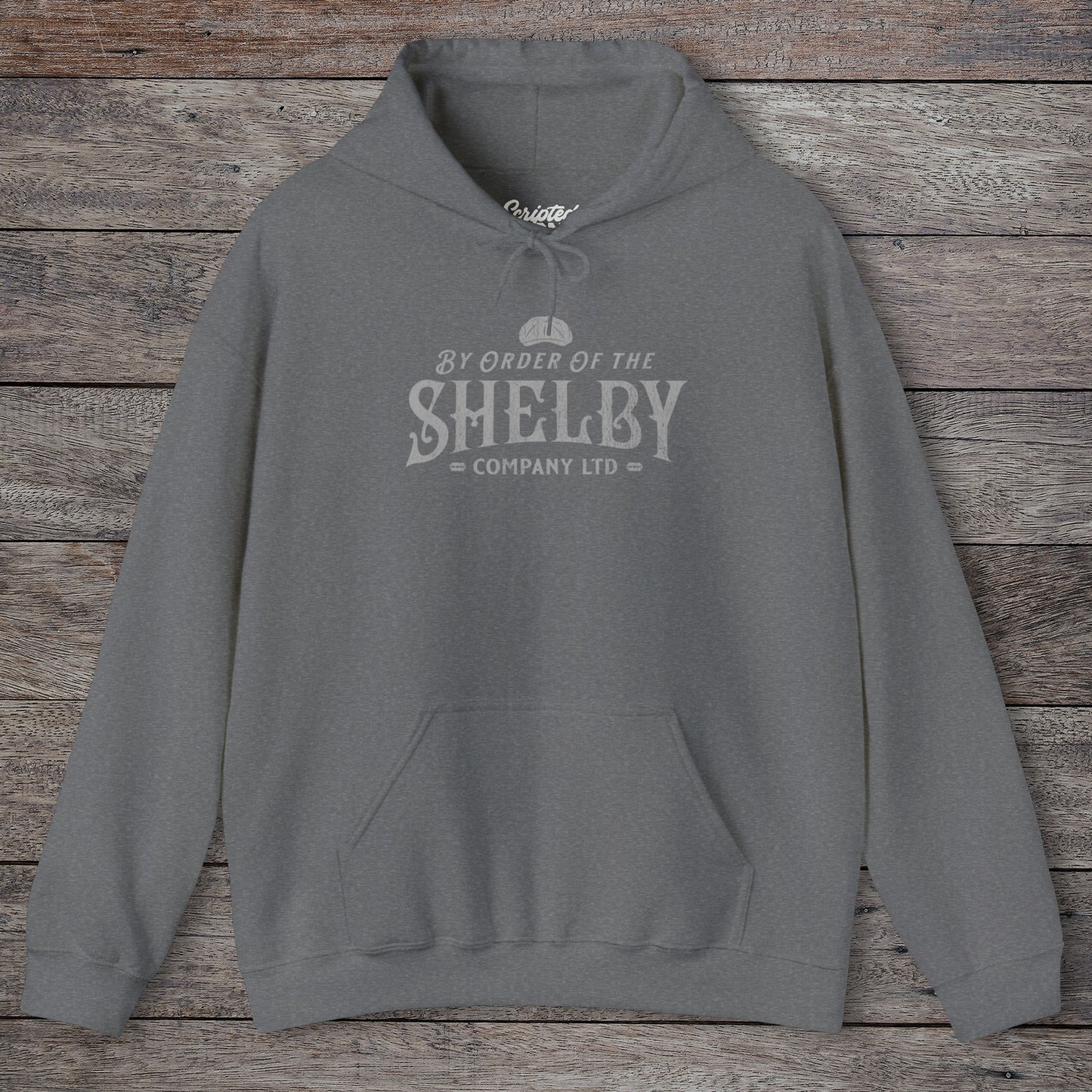 Front view of a graphite heather Shelby Company Ltd hoodie with vintage logo from Peaky Blinders, featuring flat cap and razor blades.