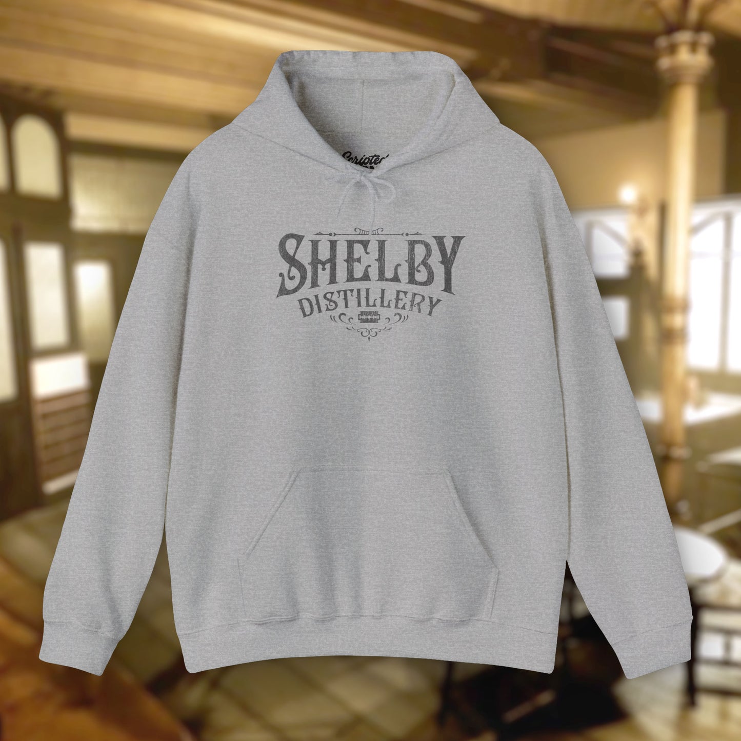 Sport Heather Gray colored Unisex Hoodie Heavy Blend Hooded Sweatshirt featuring the Shelby Company Limited Distillery Logo Graphic inspired by the TV show and movie Peaky Blinders in a vintage distressed ink-stamped worn-in style.