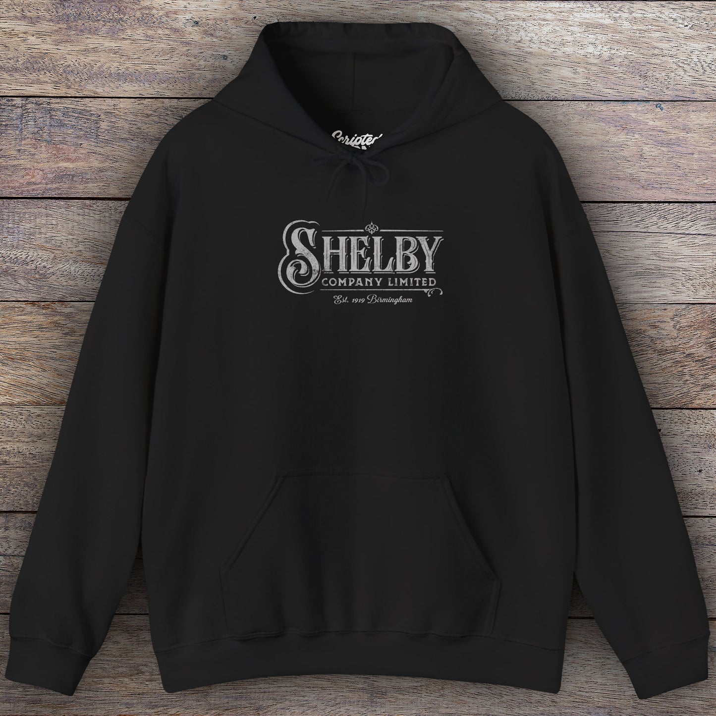 Black colored Soft Unisex Hoodie Heavy Blend Hooded Sweatshirt featuring the fictional logo Shelby Company Limited from the TV series Peaky Blinders in a vintage distressed style.