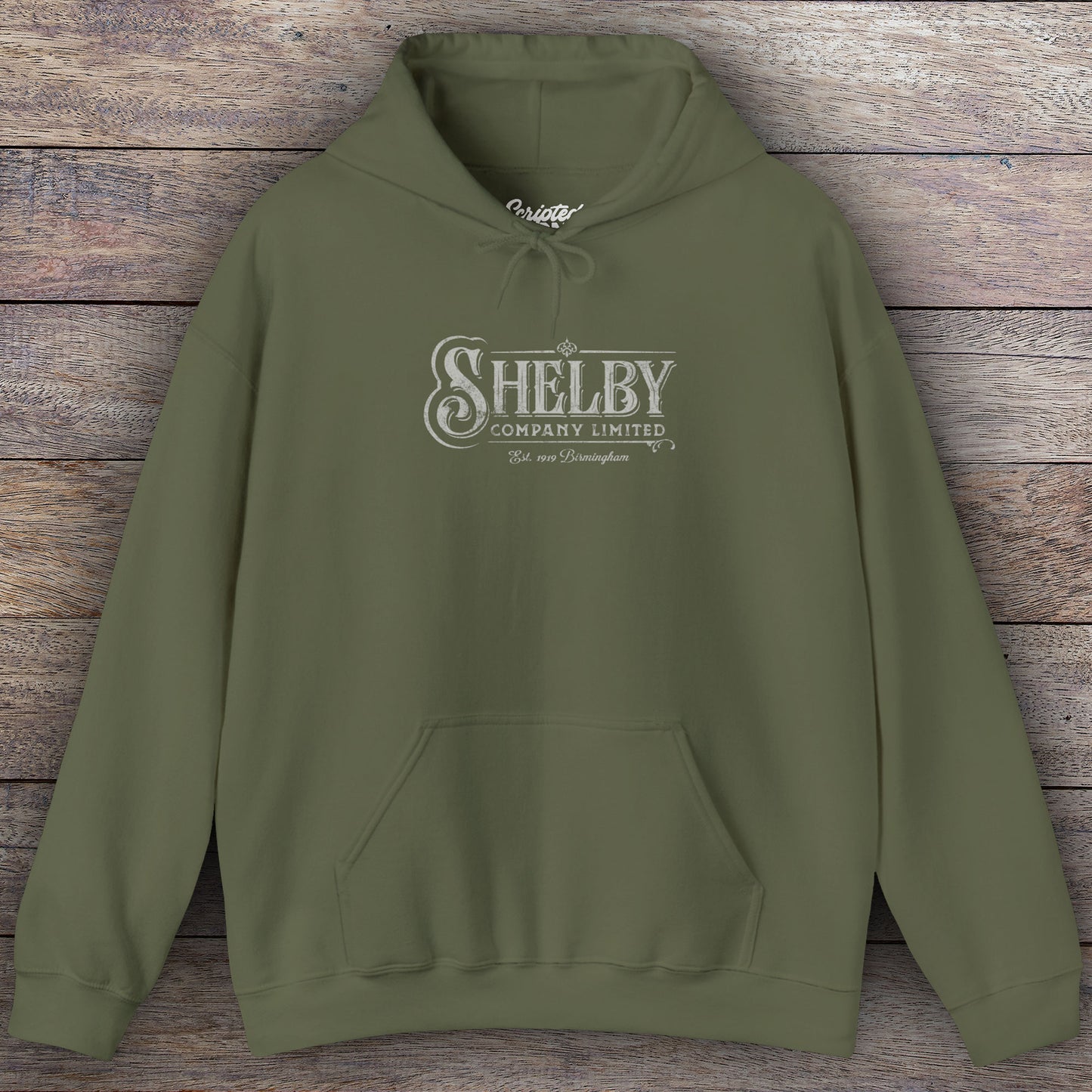 Military green colored Soft Unisex Hoodie Heavy Blend Hooded Sweatshirt featuring the fictional logo Shelby Company Limited from the TV series Peaky Blinders in a vintage distressed style.