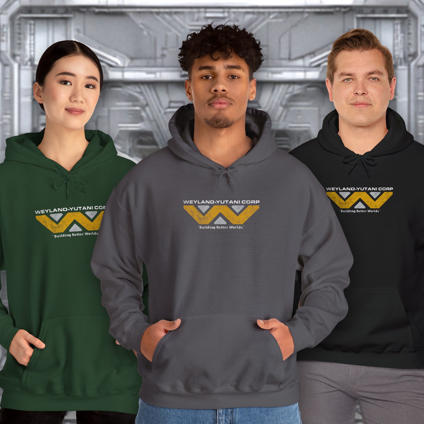 Three people wearing hoodies with Weyland-Yutani Corp logo against a metallic background