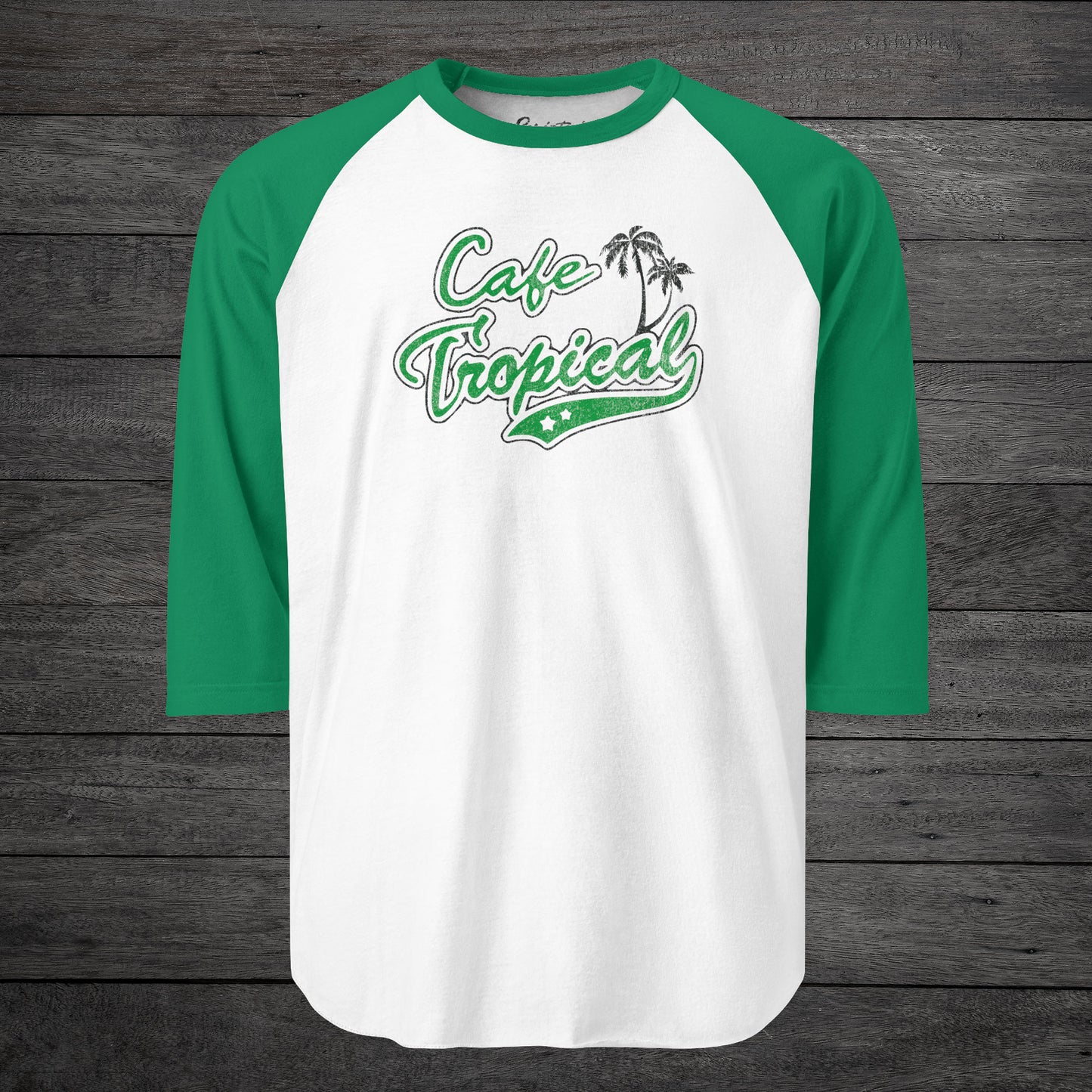 Front view of a white and Green colored soft raglan 3/4 sleeve Tultex 245 baseball shirt featuring the fictional Cafe Tropical logo that David wore in the TV Show Schitts Creek in a vintage distressed style, sold by ScriptedBrand.
