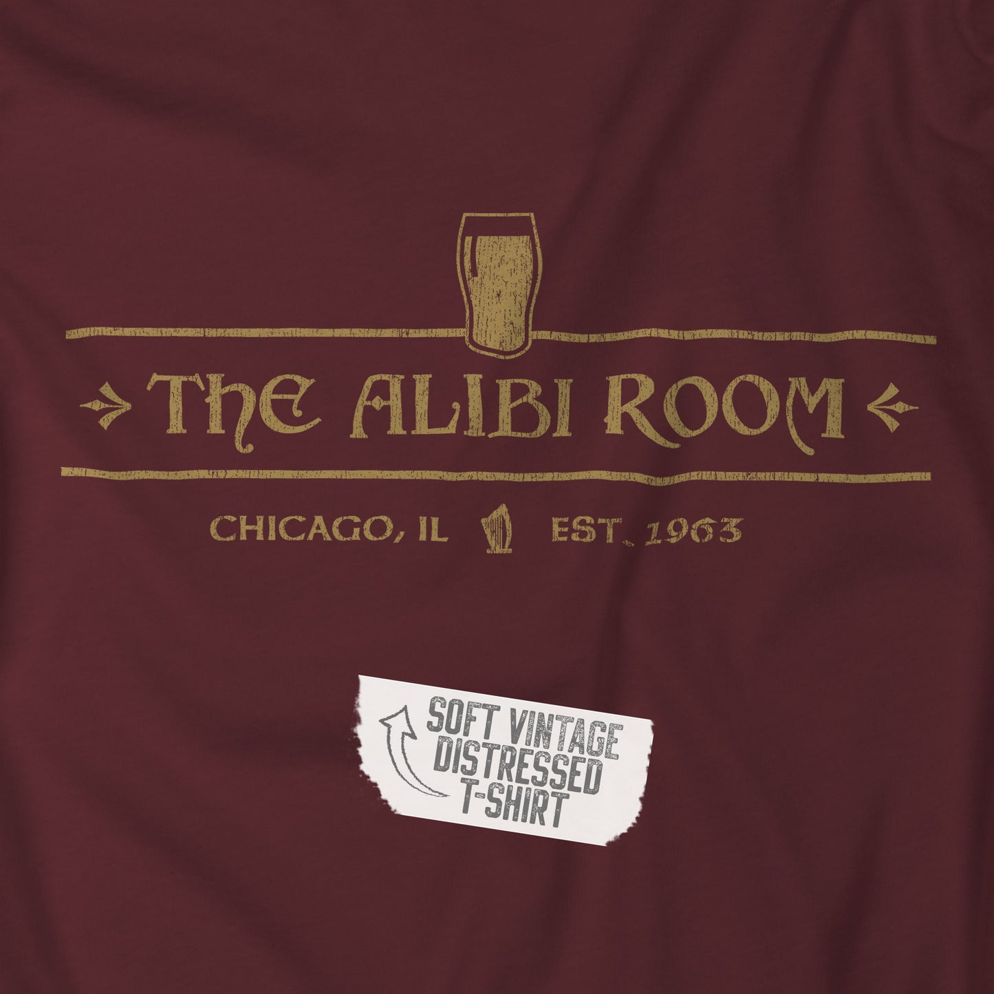 Closeup of t-shirt featuring The Alibi Room logo graphic inspired by the TV show Shameless in a vintage distressed style.