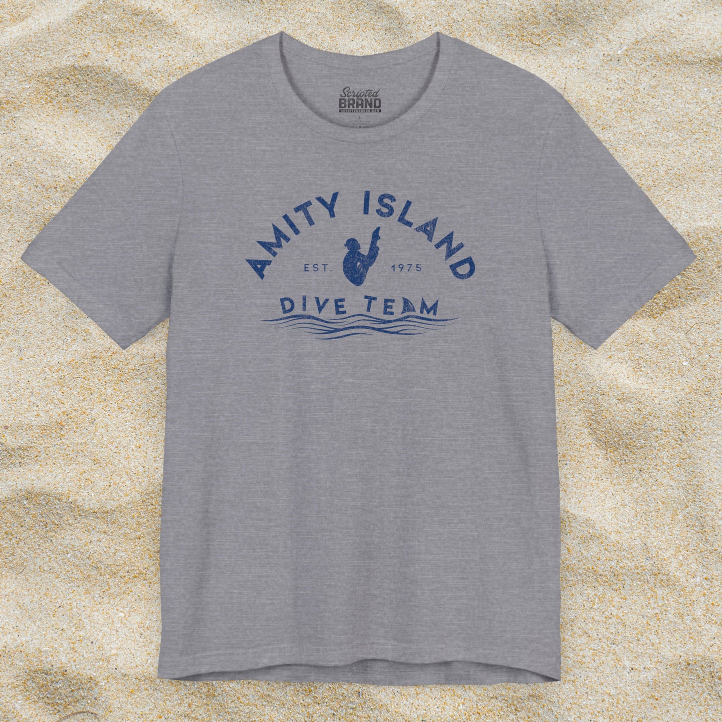 Front view of heather storm grey Bella+Canvas t-shirt with vintage-style Amity Island Dive Team logo, inspired by the movie Jaws.