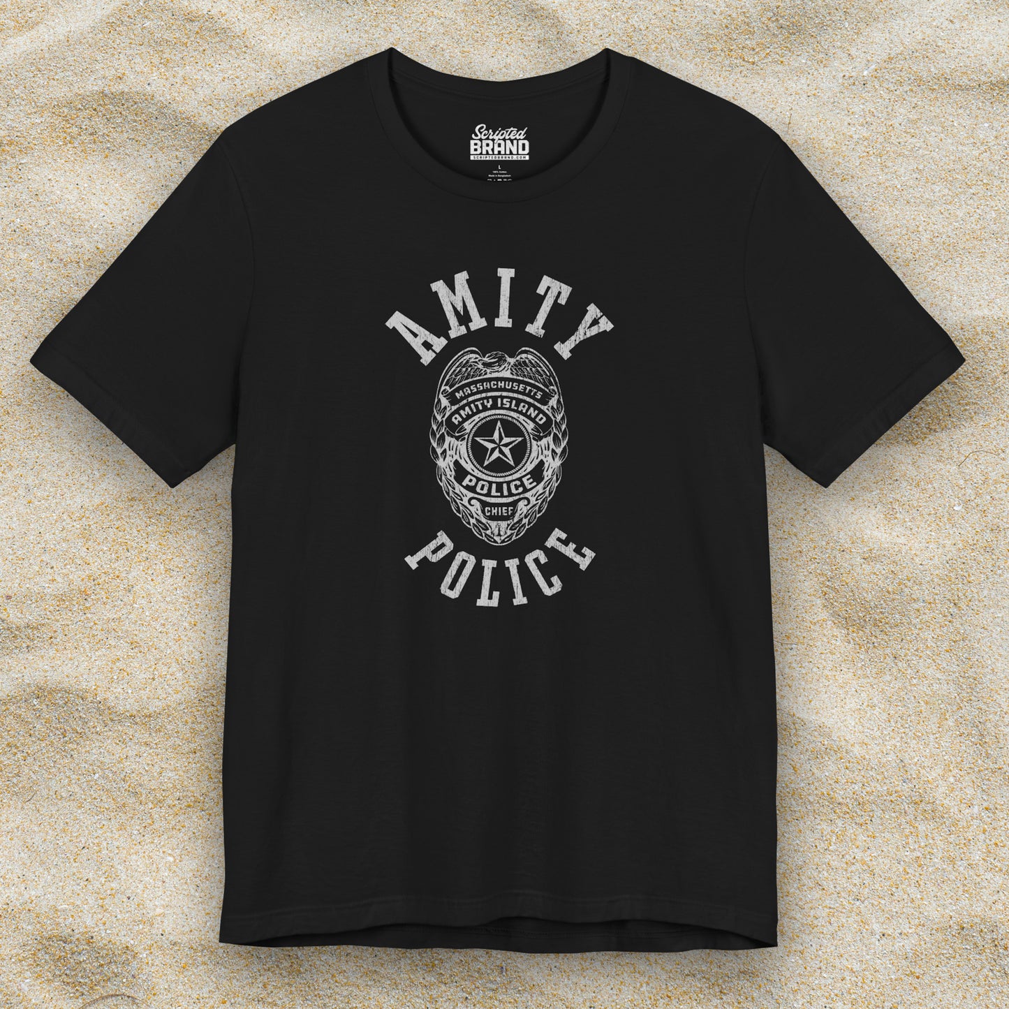 Front view of a black colored Soft unisex Bella+Canvas 3001 short-sleeve t-shirt featuring an Amity Island Police logo graphic, designed by ScriptedBrand, and inspired by the movie Jaws in a vintage distressed style.