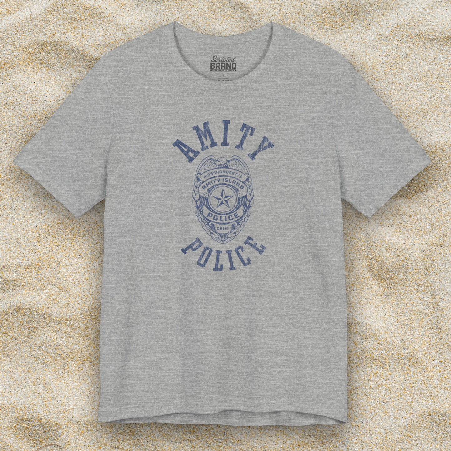 Front view of an athletic heather grey colored Soft unisex Bella+Canvas 3001 short-sleeve t-shirt featuring an Amity Island Police logo graphic, designed by ScriptedBrand, and inspired by the movie Jaws in a vintage distressed style.