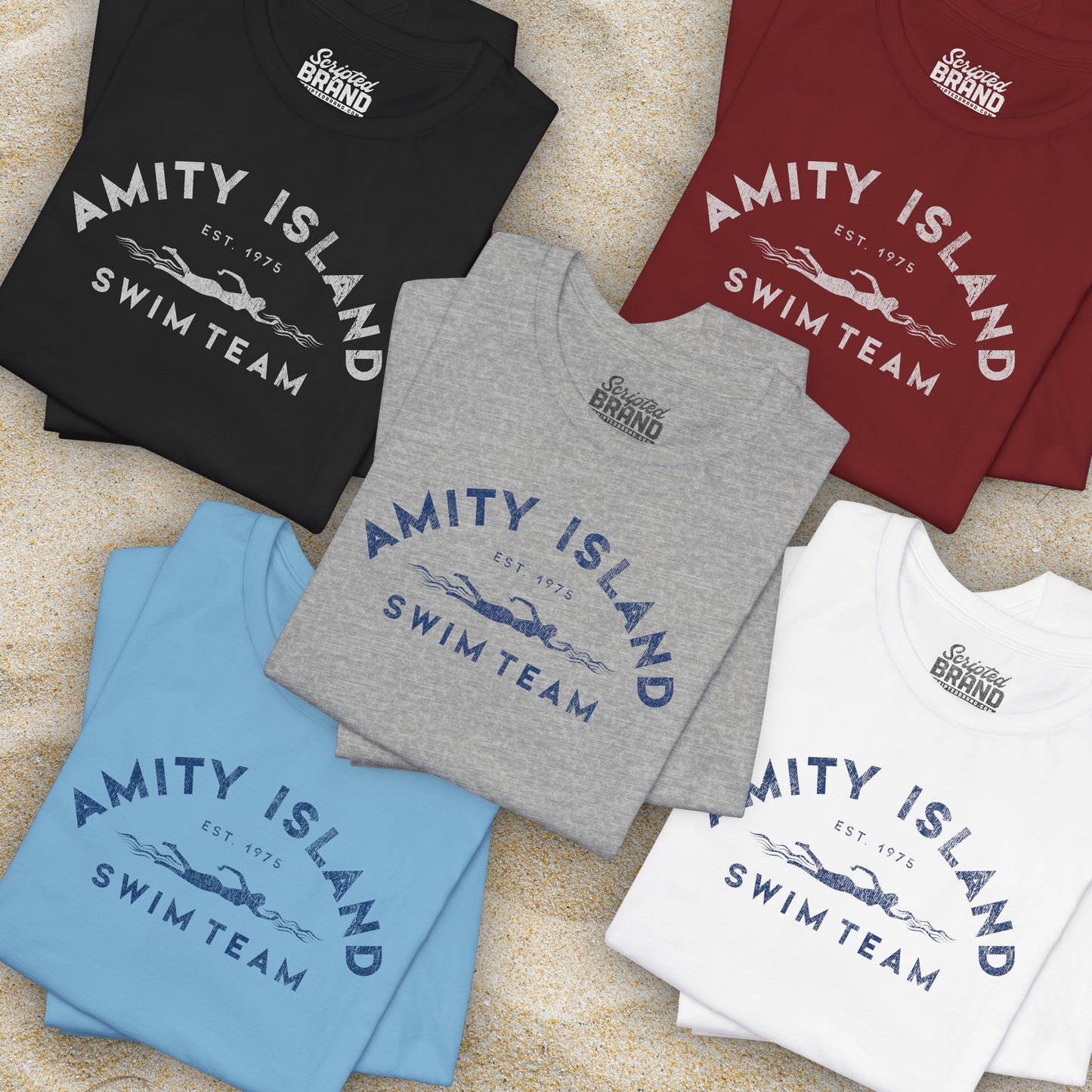Group of 5 folded Soft unisex Bella+Canvas 3001 short-sleeve t-shirts featuring an Amity Island Swim Team logo graphic, designed by ScriptedBrand, and inspired by the movie Jaws in a vintage distressed style.