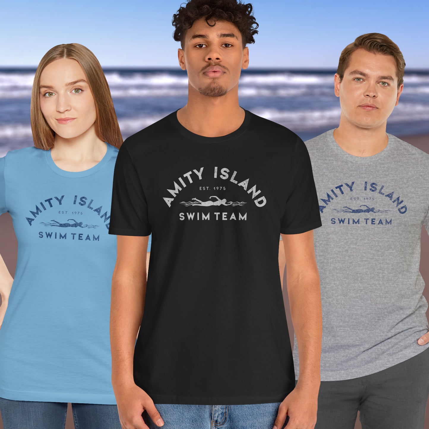 3 models wearing Soft unisex Bella+Canvas 3001 short-sleeve t-shirts featuring an Amity Island Swim Team logo graphic, designed by ScriptedBrand, and inspired by the movie Jaws in a vintage distressed style.