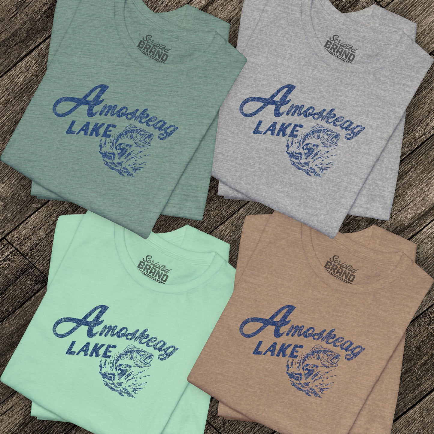 Four folded t-shirts featuring the Amoskeag Lake graphic worn by Salma Hayek in the movie Grown Ups in a vintage distressed style.