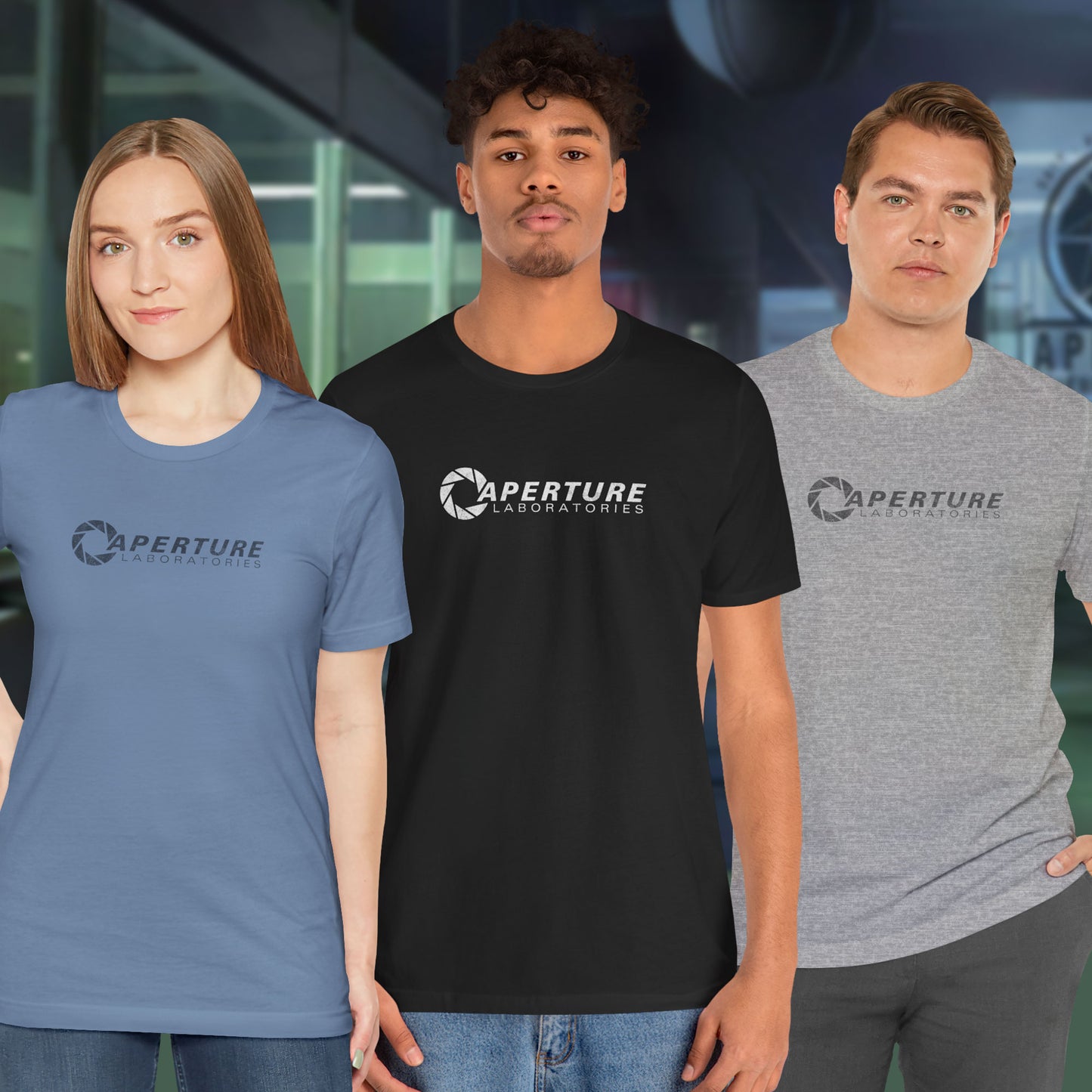 3 models wearing soft Bella+Canvas t-shirts with the Aperture Laboratories logo from the video game Portal and Portal 2 in a vintage ink-stamped distressed style.